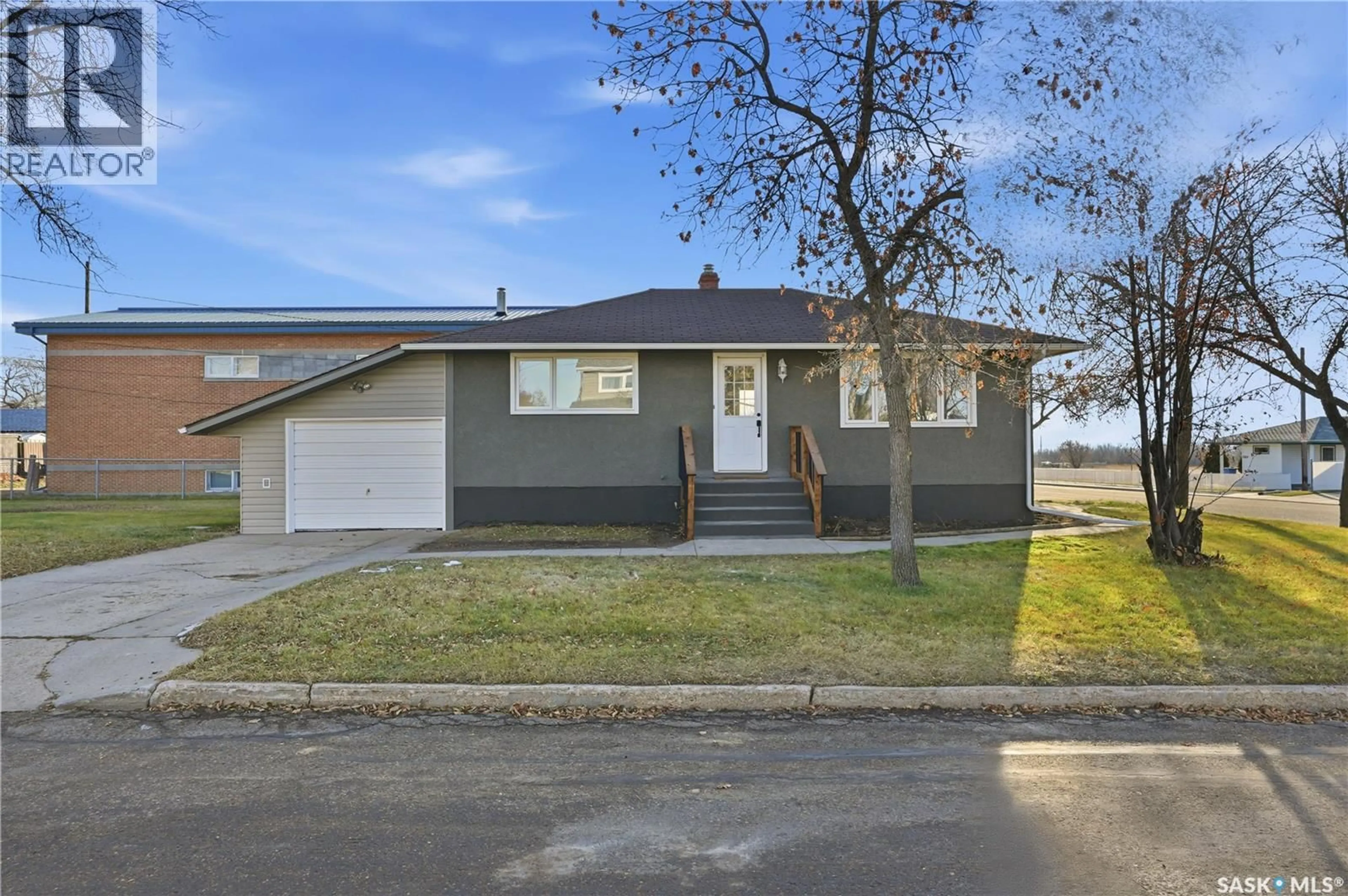 Home with vinyl exterior material, street for 1492 92ND STREET, North Battleford Saskatchewan S9A0A8