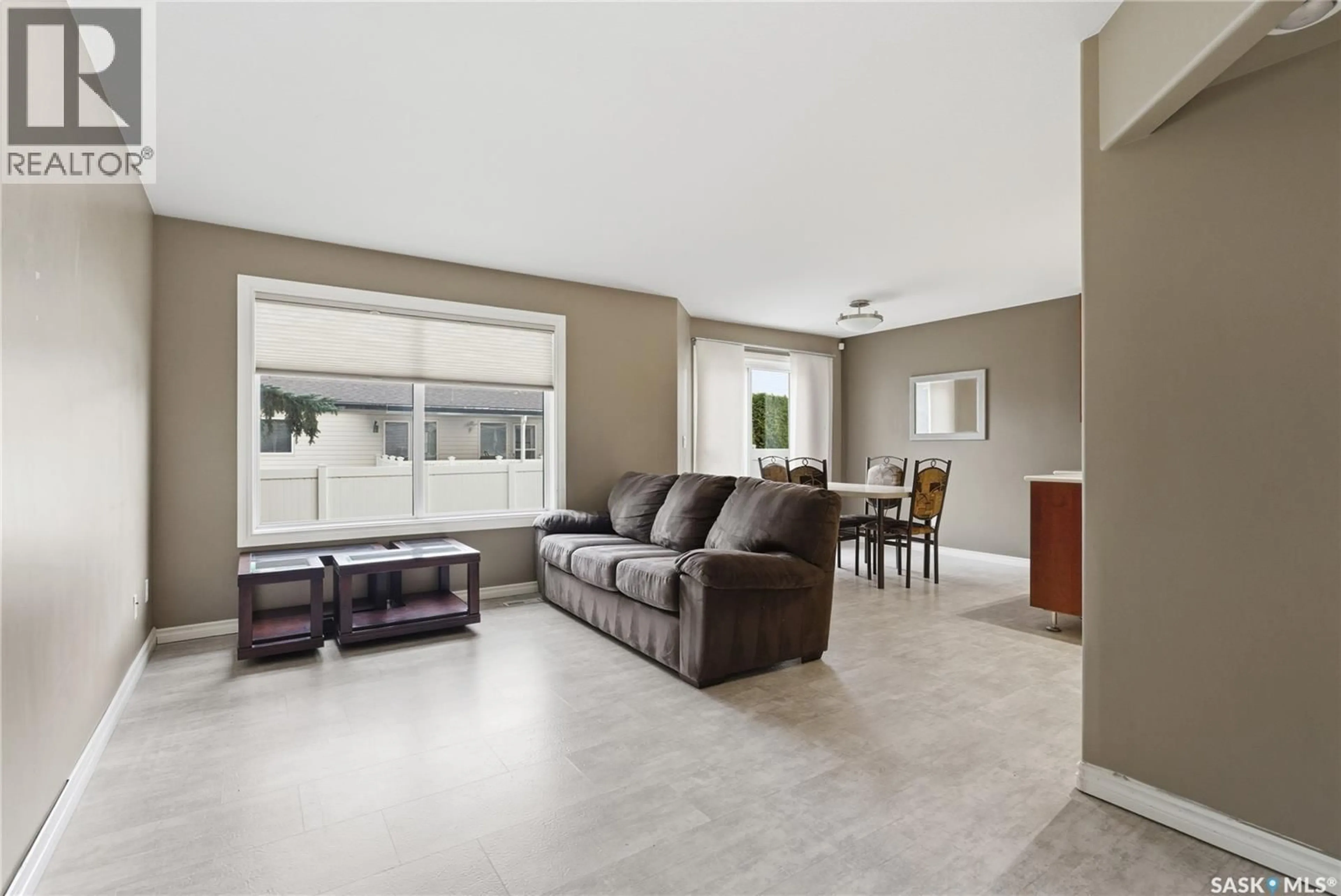 Living room with furniture, ceramic/tile floor for 515 - 118 MCWILLIE AVENUE, Saskatoon Saskatchewan S7S1K8