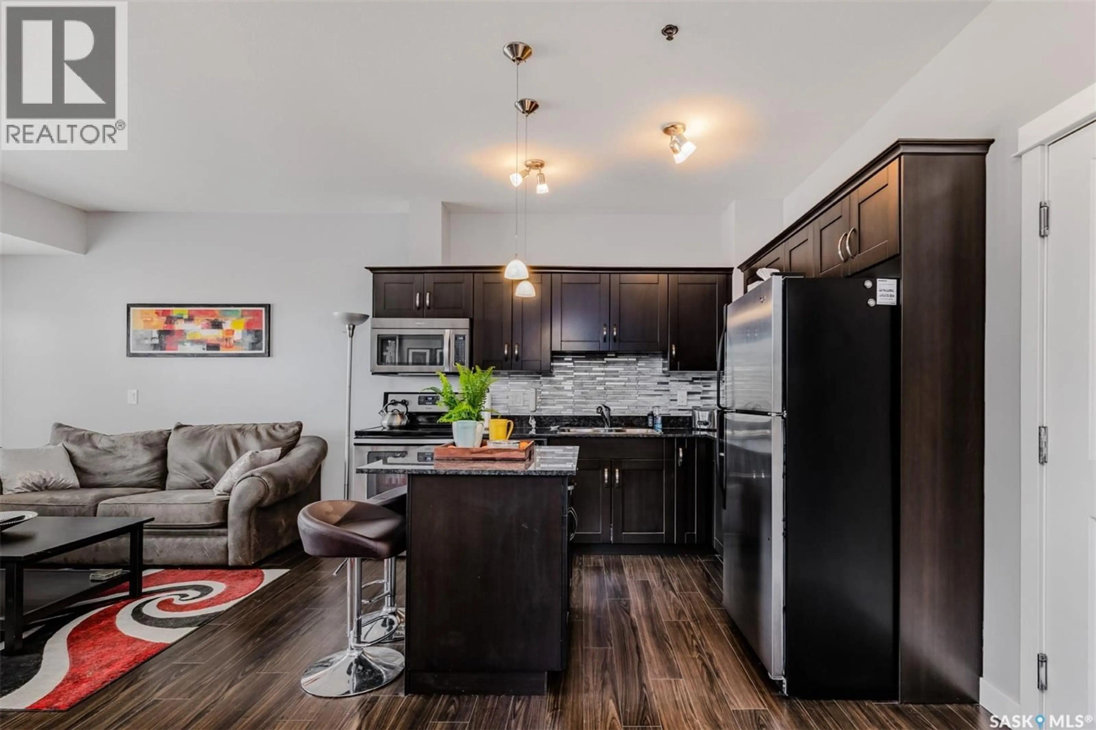 Open concept kitchen, wood/laminate floor for 307 - 710 HART ROAD, Saskatoon Saskatchewan S7M1L2