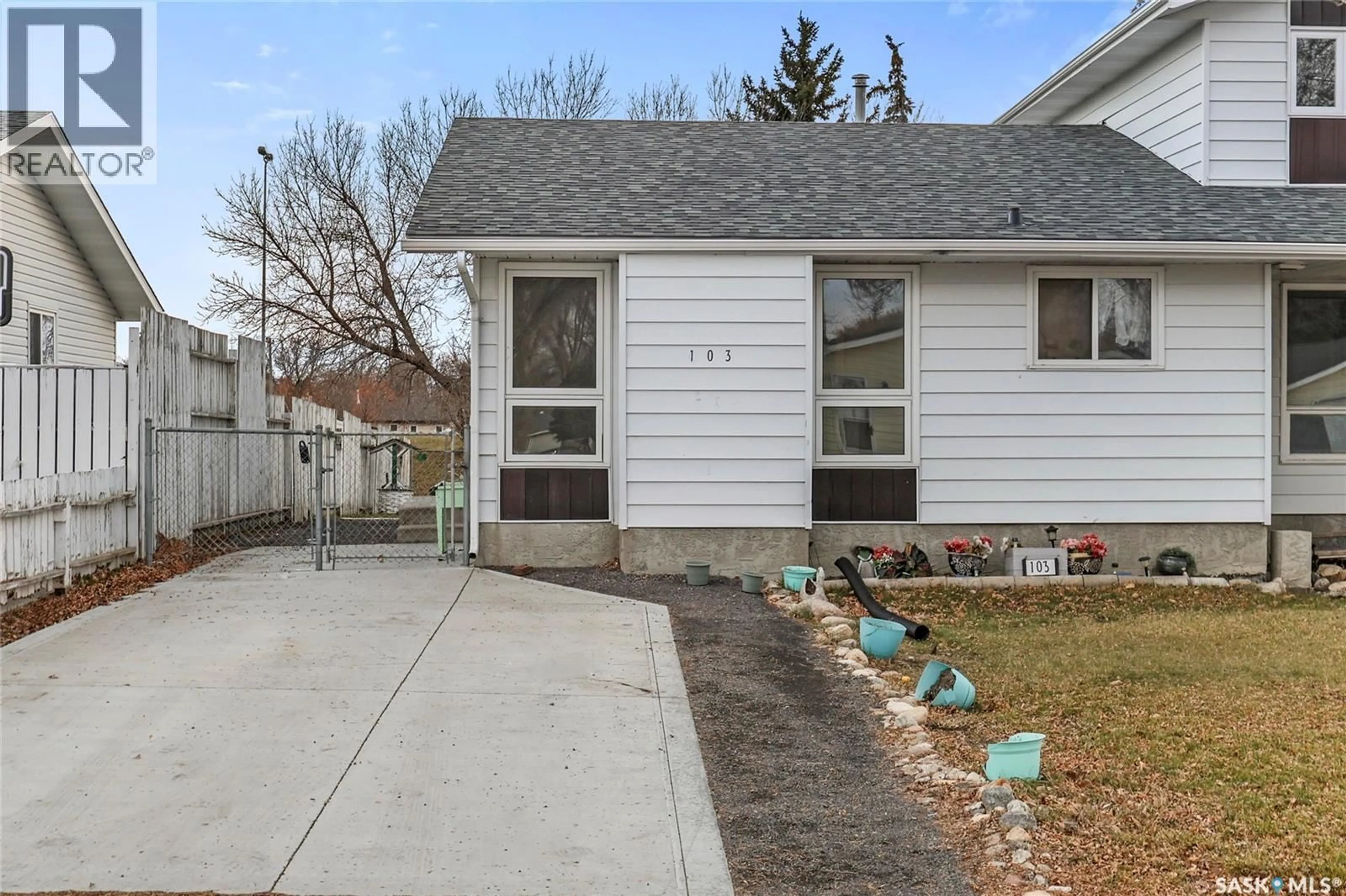 Home with vinyl exterior material, street for 103 CHURCH DRIVE, Regina Saskatchewan S4X1L7