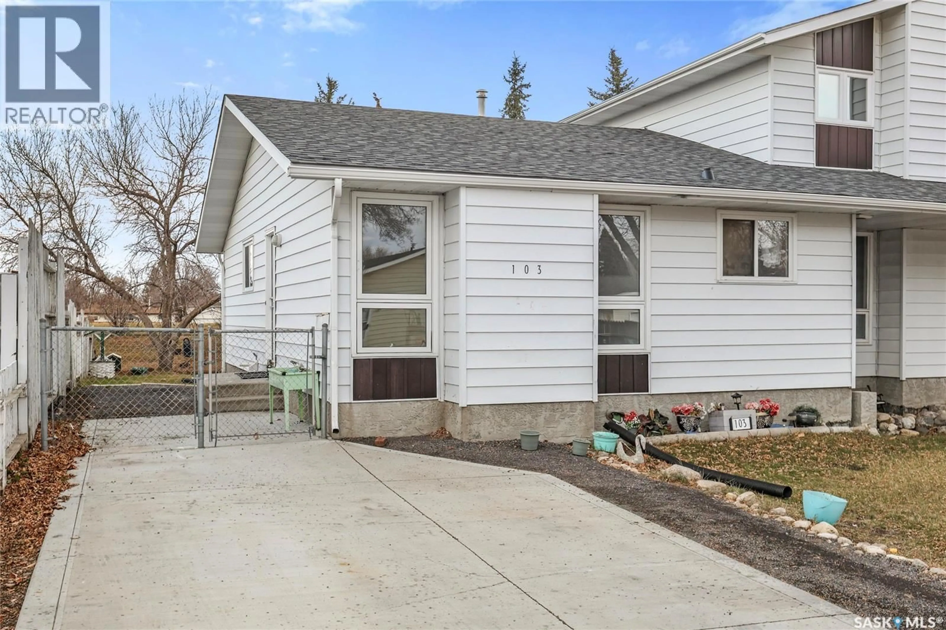 Home with vinyl exterior material, street for 103 CHURCH DRIVE, Regina Saskatchewan S4X1L7