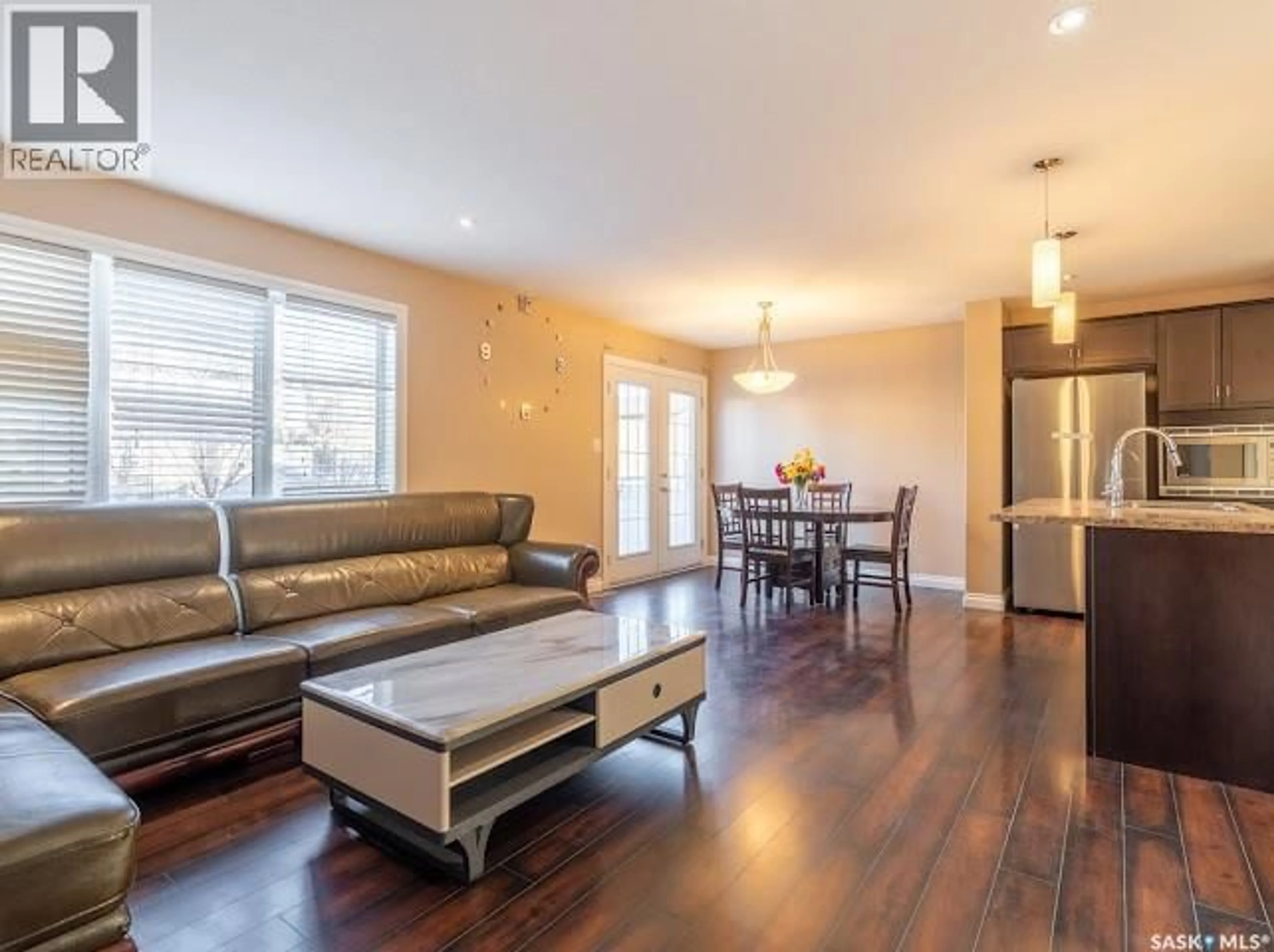 Living room with furniture, wood/laminate floor for 4637 PADWICK ROAD, Regina Saskatchewan S4W0C3