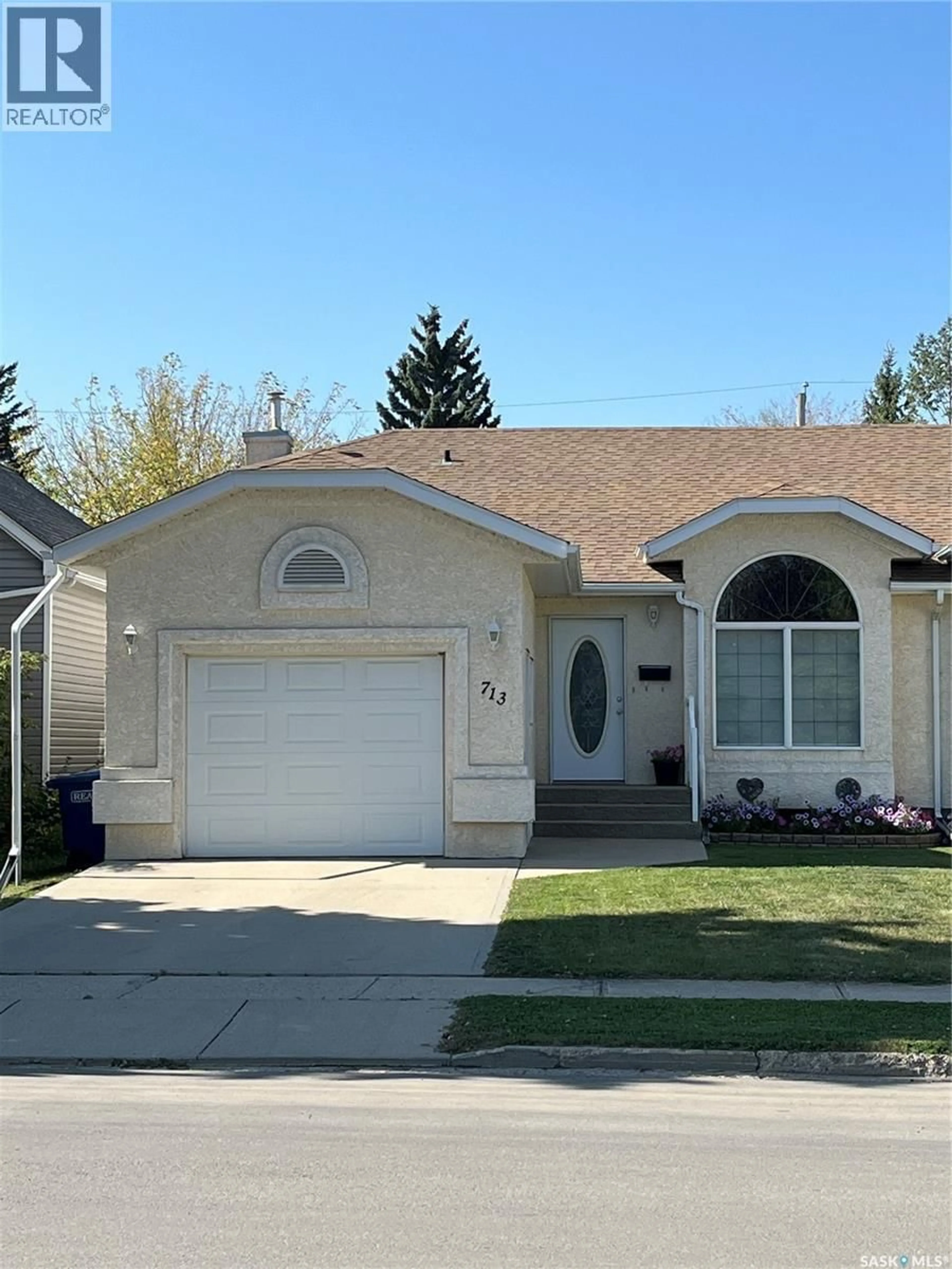 Home with vinyl exterior material, street for 713 9TH STREET, Humboldt Saskatchewan S0K2A0