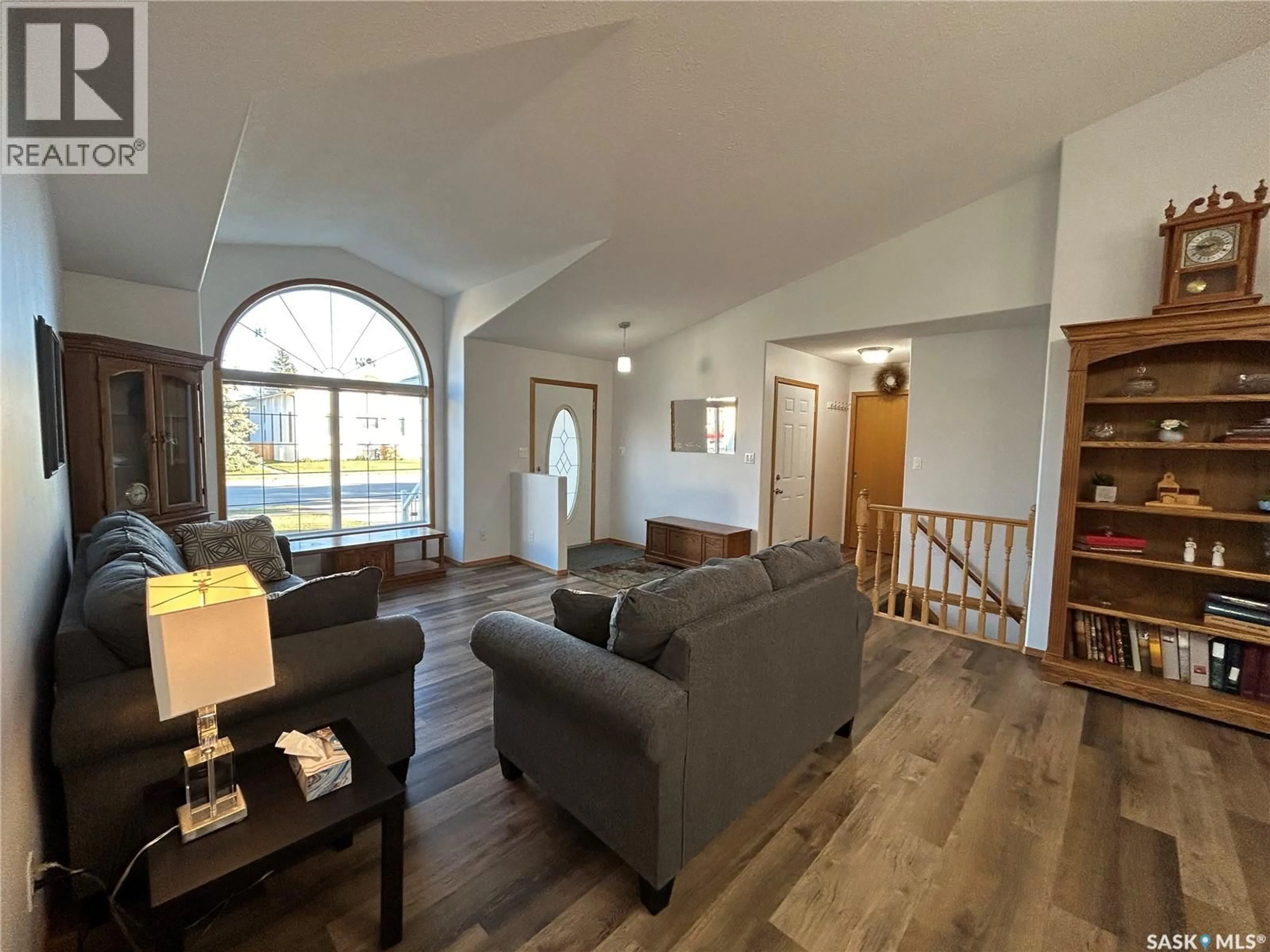 Living room with furniture, wood/laminate floor for 713 9TH STREET, Humboldt Saskatchewan S0K2A0