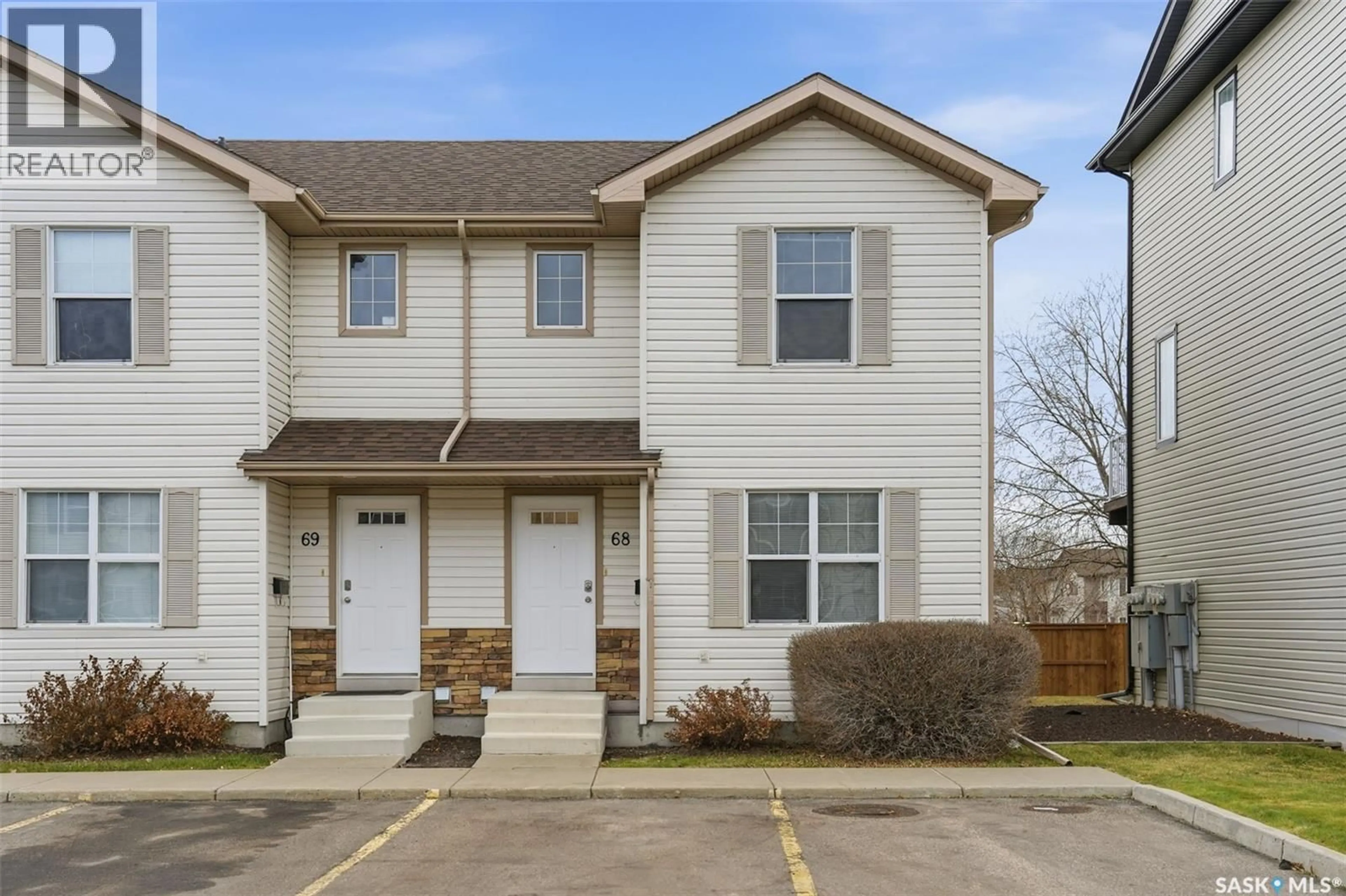 Home with vinyl exterior material, street for 68 135 PAWLYCHENKO LANE, Saskatoon Saskatchewan S7V1J8
