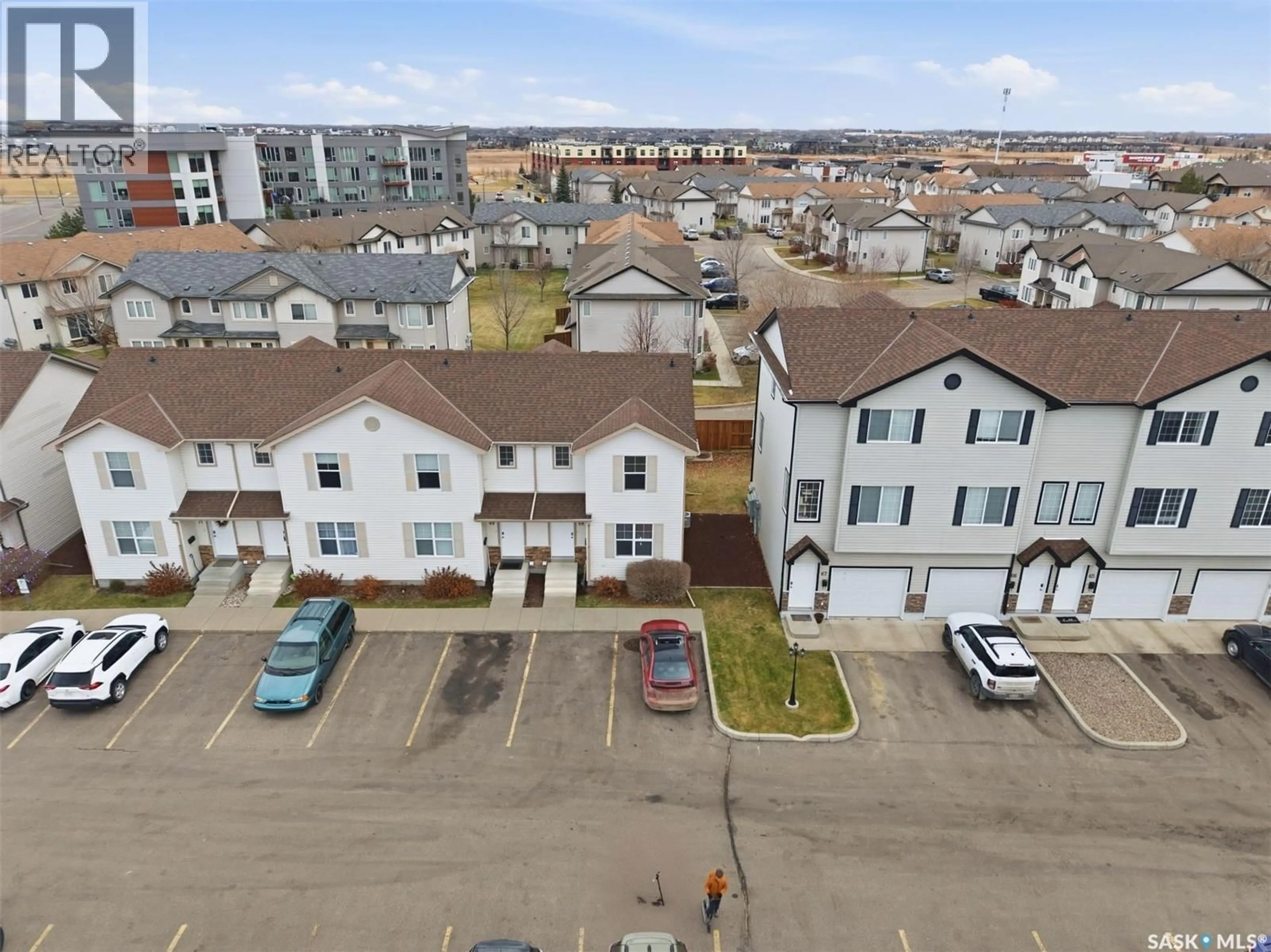 A pic from outside/outdoor area/front of a property/back of a property/a pic from drone, street for 68 135 PAWLYCHENKO LANE, Saskatoon Saskatchewan S7V1J8