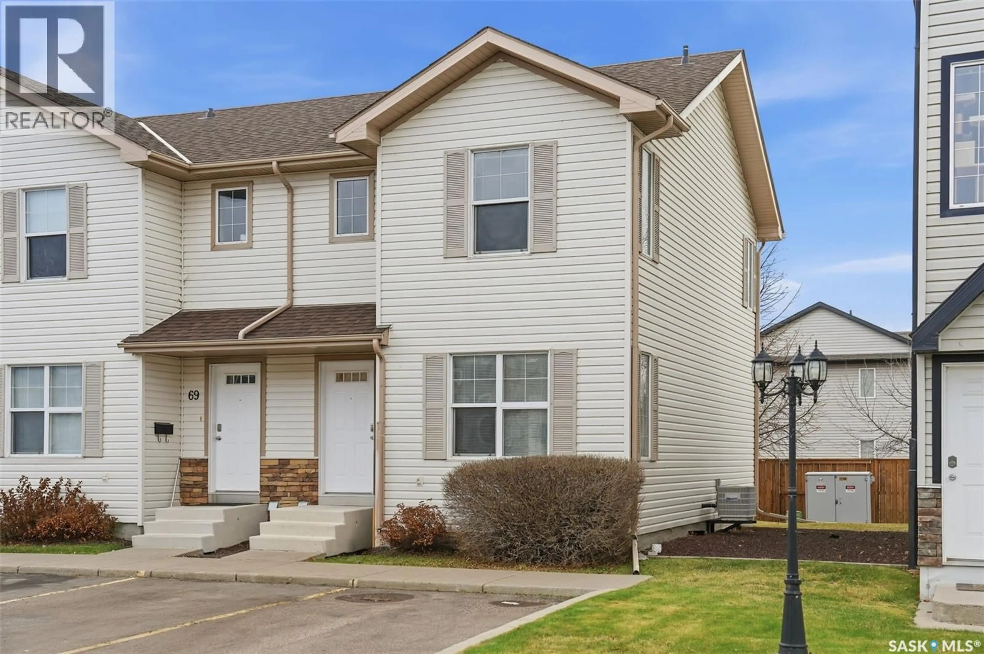 Home with vinyl exterior material, street for 68 135 PAWLYCHENKO LANE, Saskatoon Saskatchewan S7V1J8