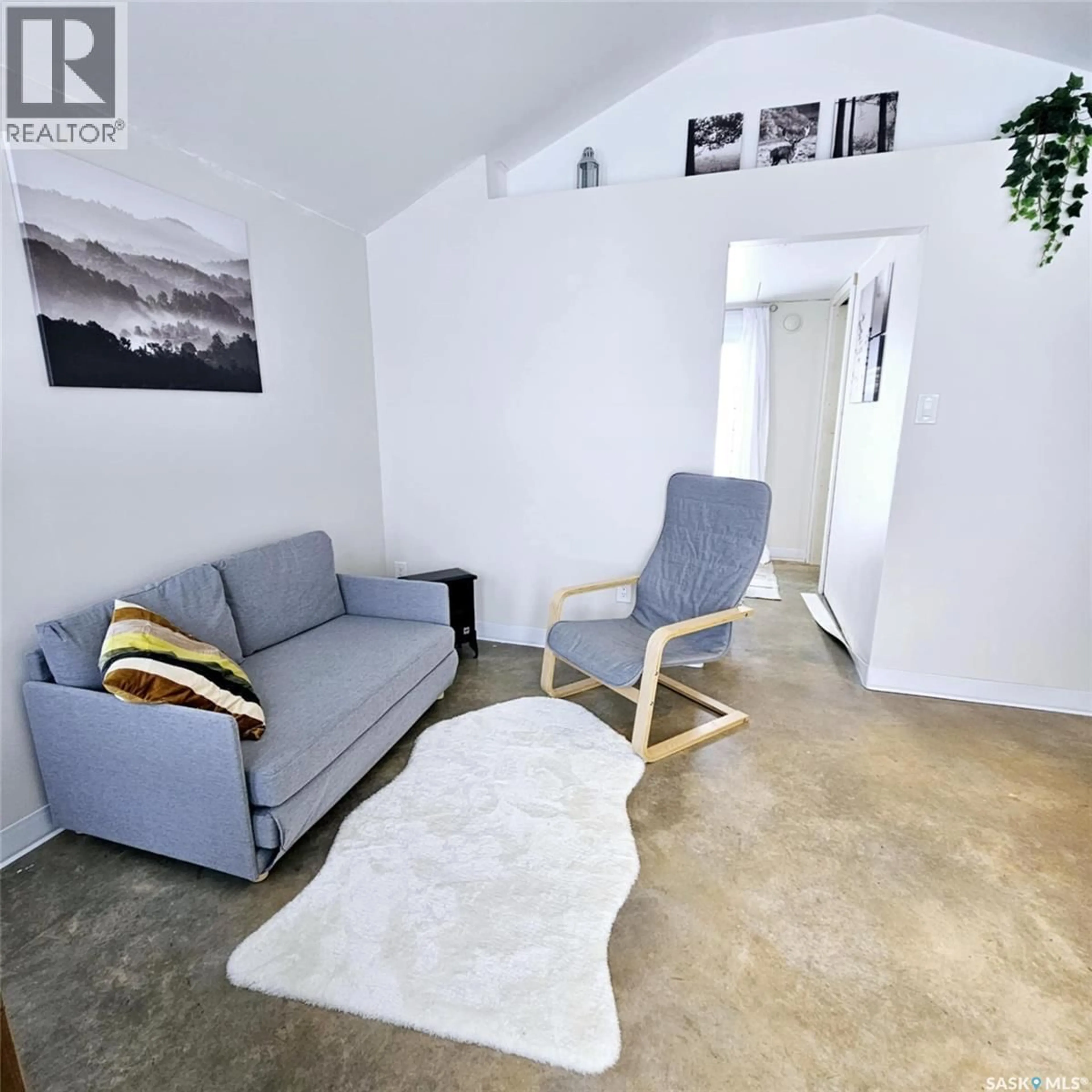 Living room with furniture, cement floor for 1 BECK STREET, Dubuc Saskatchewan S0A0R0