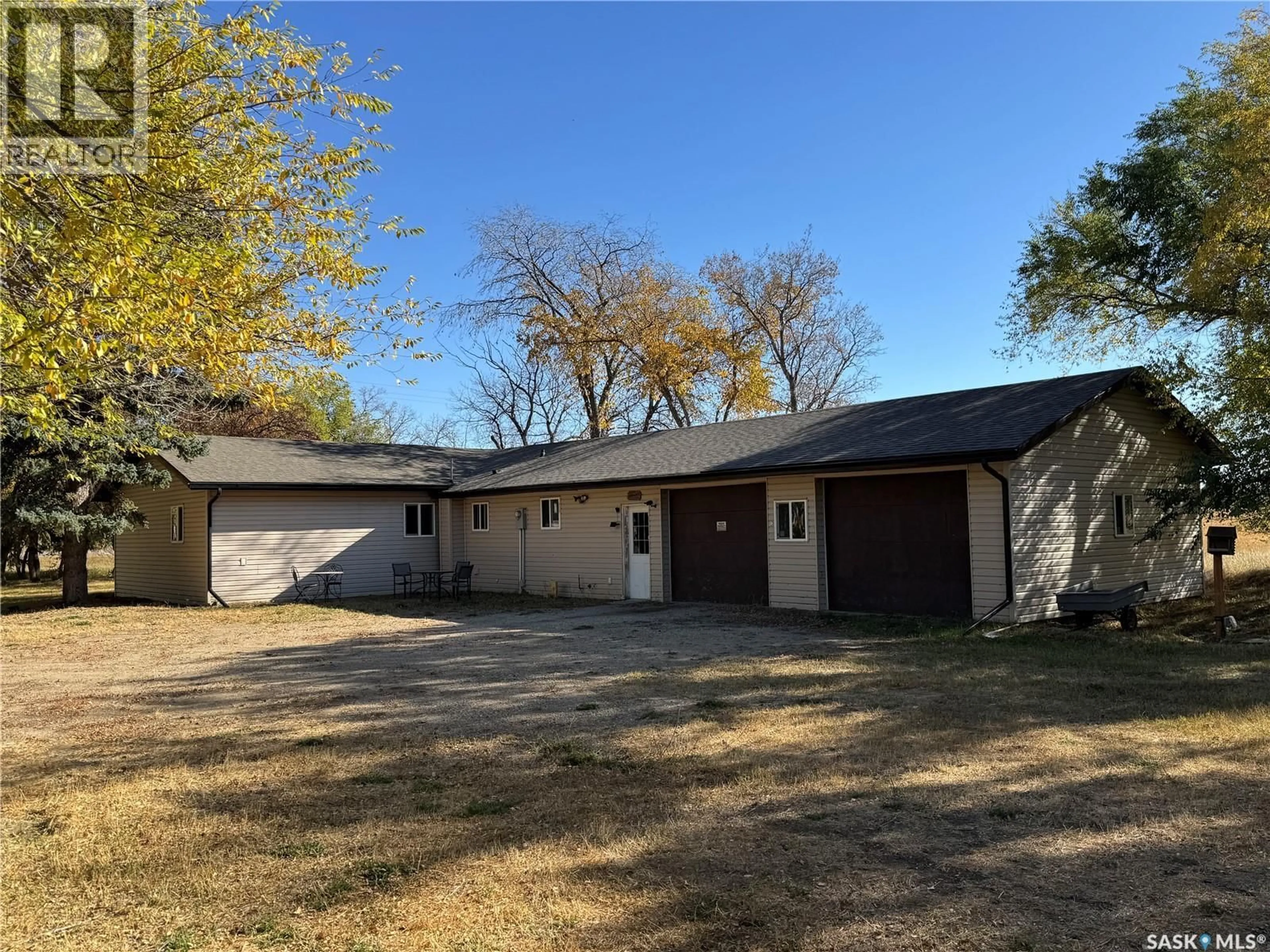 A pic from outside/outdoor area/front of a property/back of a property/a pic from drone, building for BUNDSCHUH ESTATE ACREAGE, Biggar Rm No. 347 Saskatchewan S0K0M0