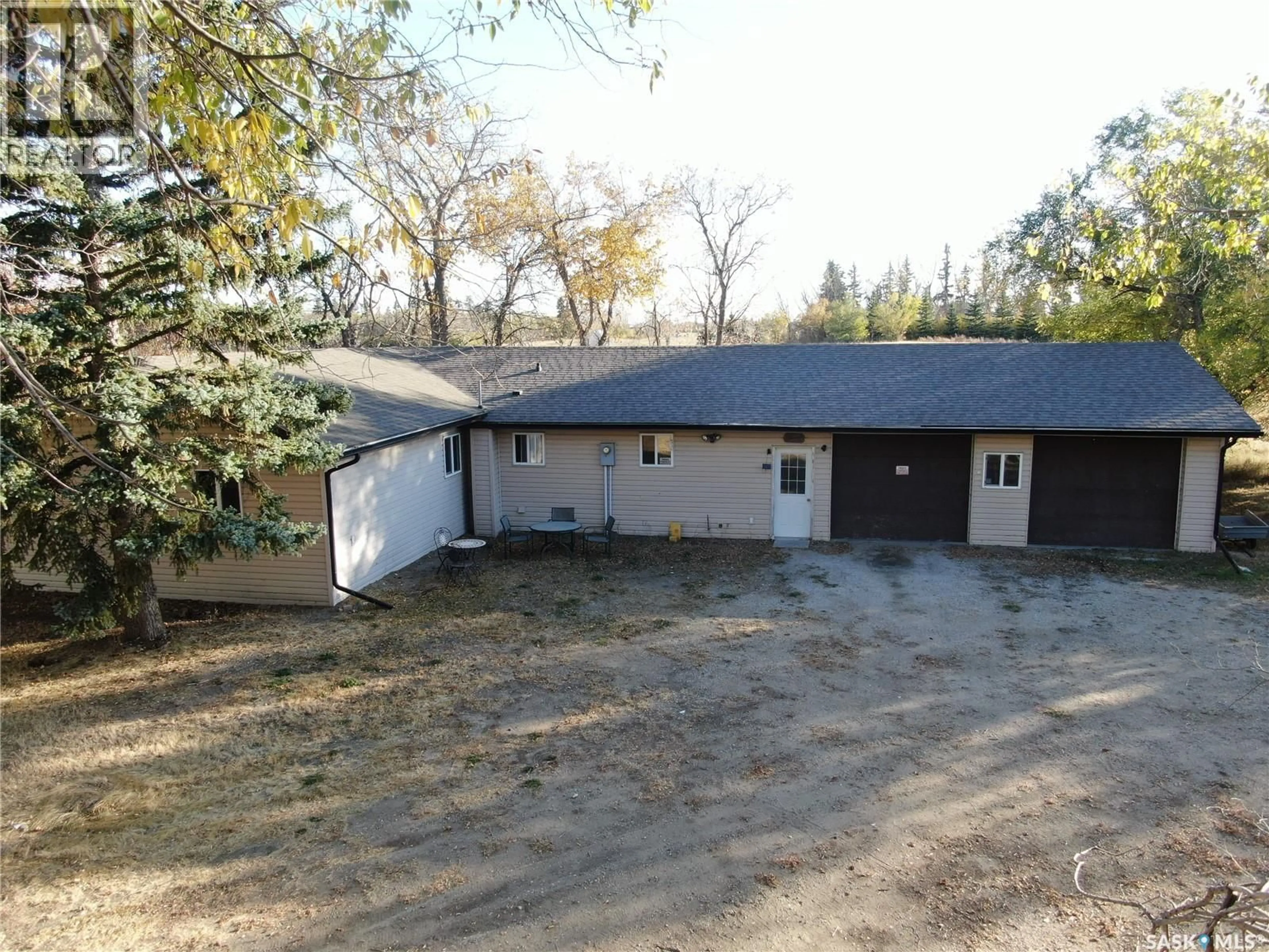 A pic from outside/outdoor area/front of a property/back of a property/a pic from drone, building for BUNDSCHUH ESTATE ACREAGE, Biggar Rm No. 347 Saskatchewan S0K0M0