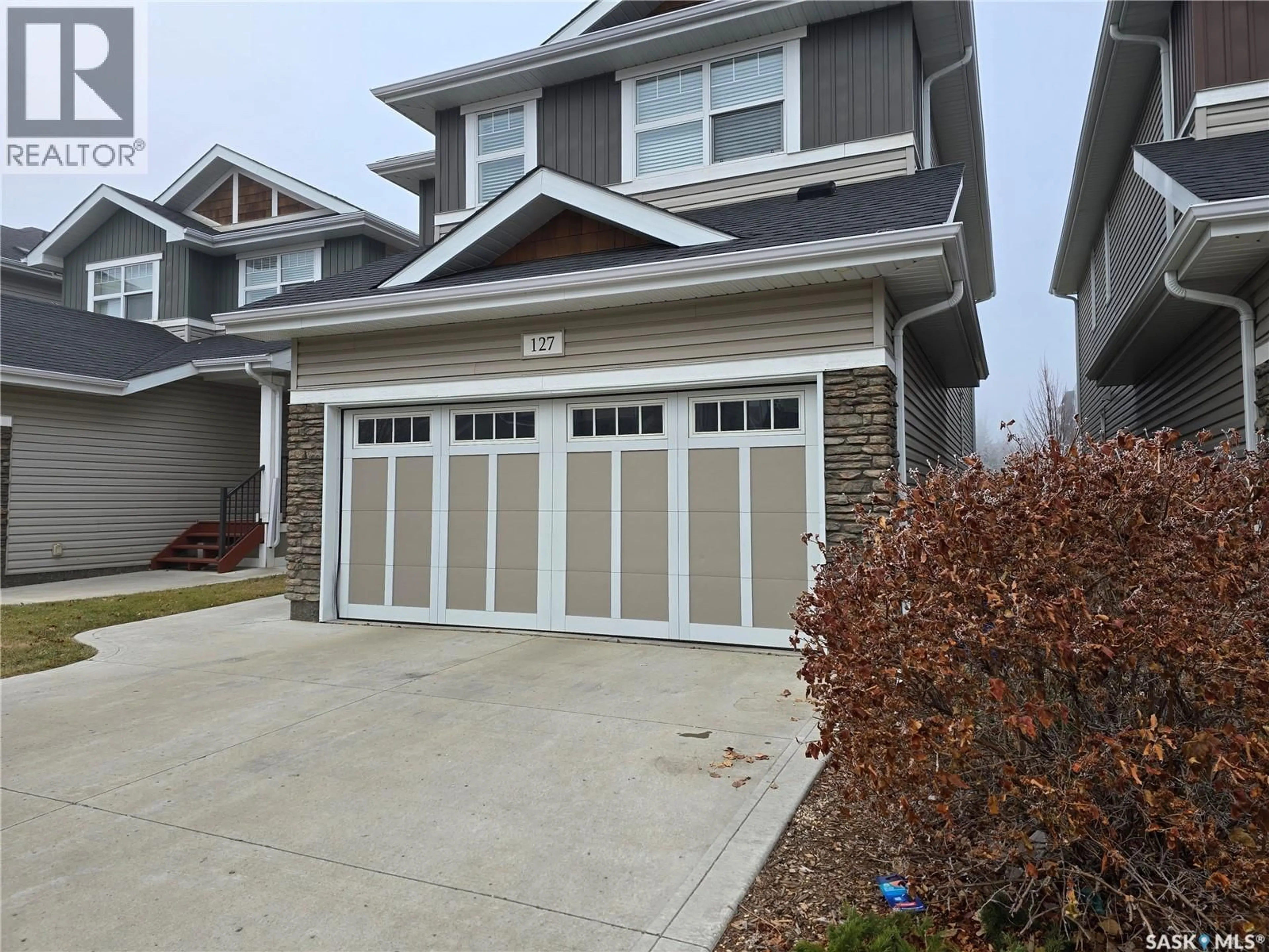 Home with vinyl exterior material, street for 315 - 127 DICKSON CRESCENT, Saskatoon Saskatchewan S7T0Z1