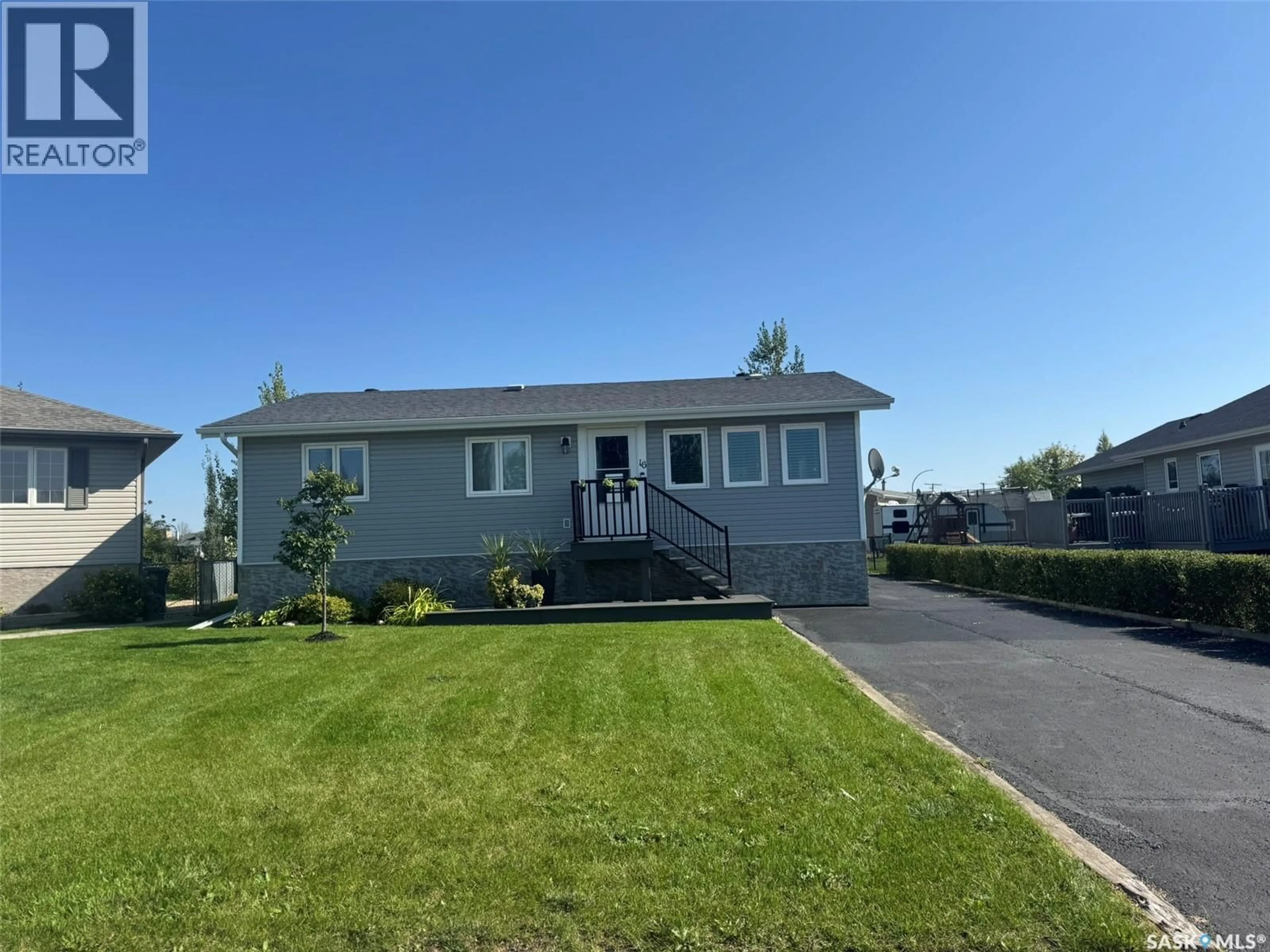Home with vinyl exterior material, street for 16 MANOR BAY, Carlyle Saskatchewan S0C0R0