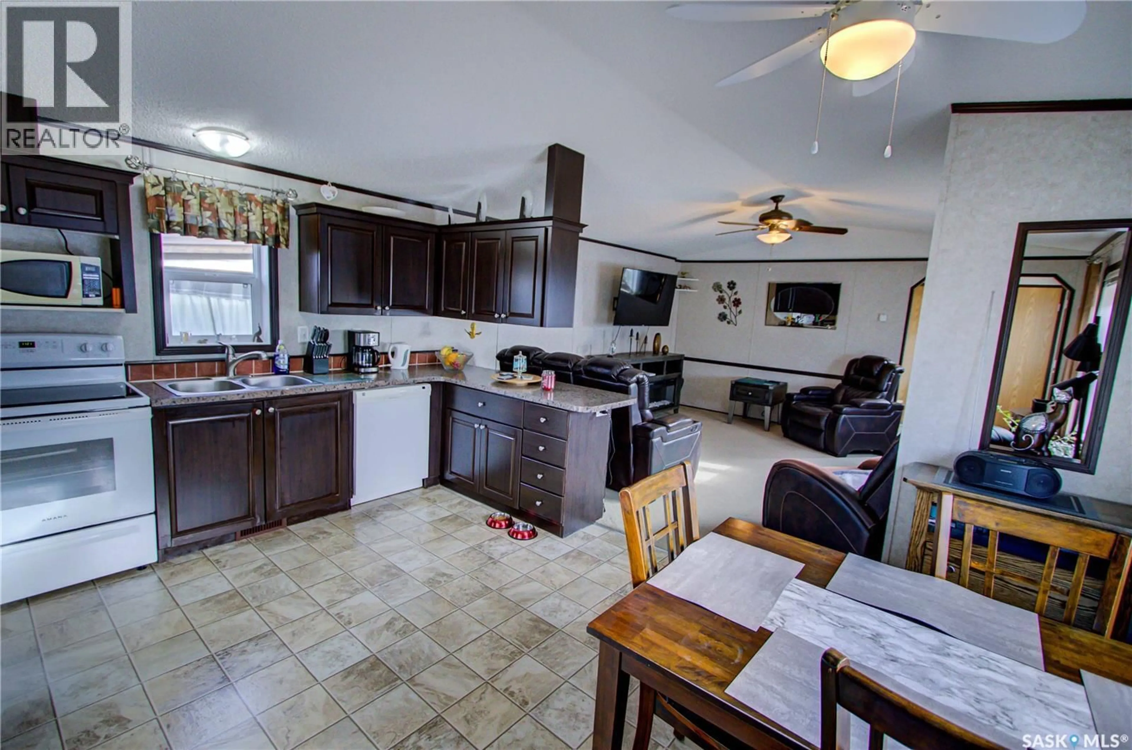 Open concept kitchen, ceramic/tile floor for 105 RUTTLE AVENUE, Kinistino Saskatchewan S0J1H0