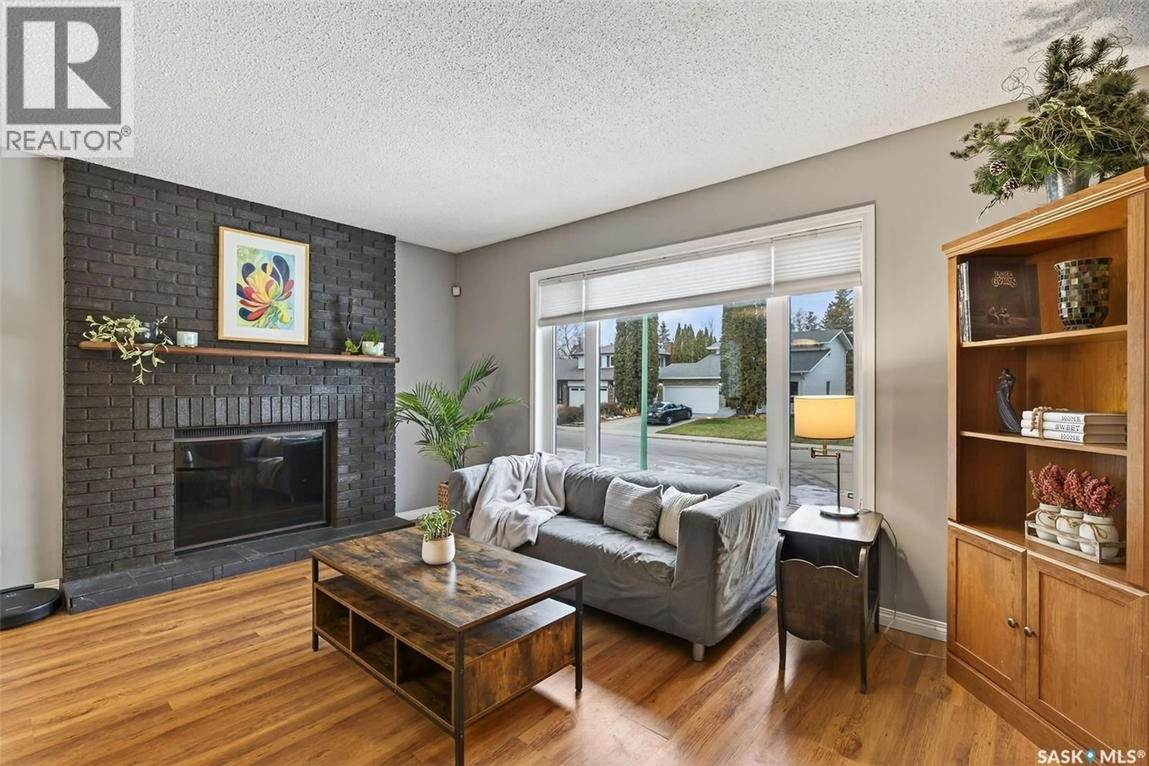 Living room with furniture, wood/laminate floor for 3289 GREY OWL CRESCENT, Prince Albert Saskatchewan S6V6X6