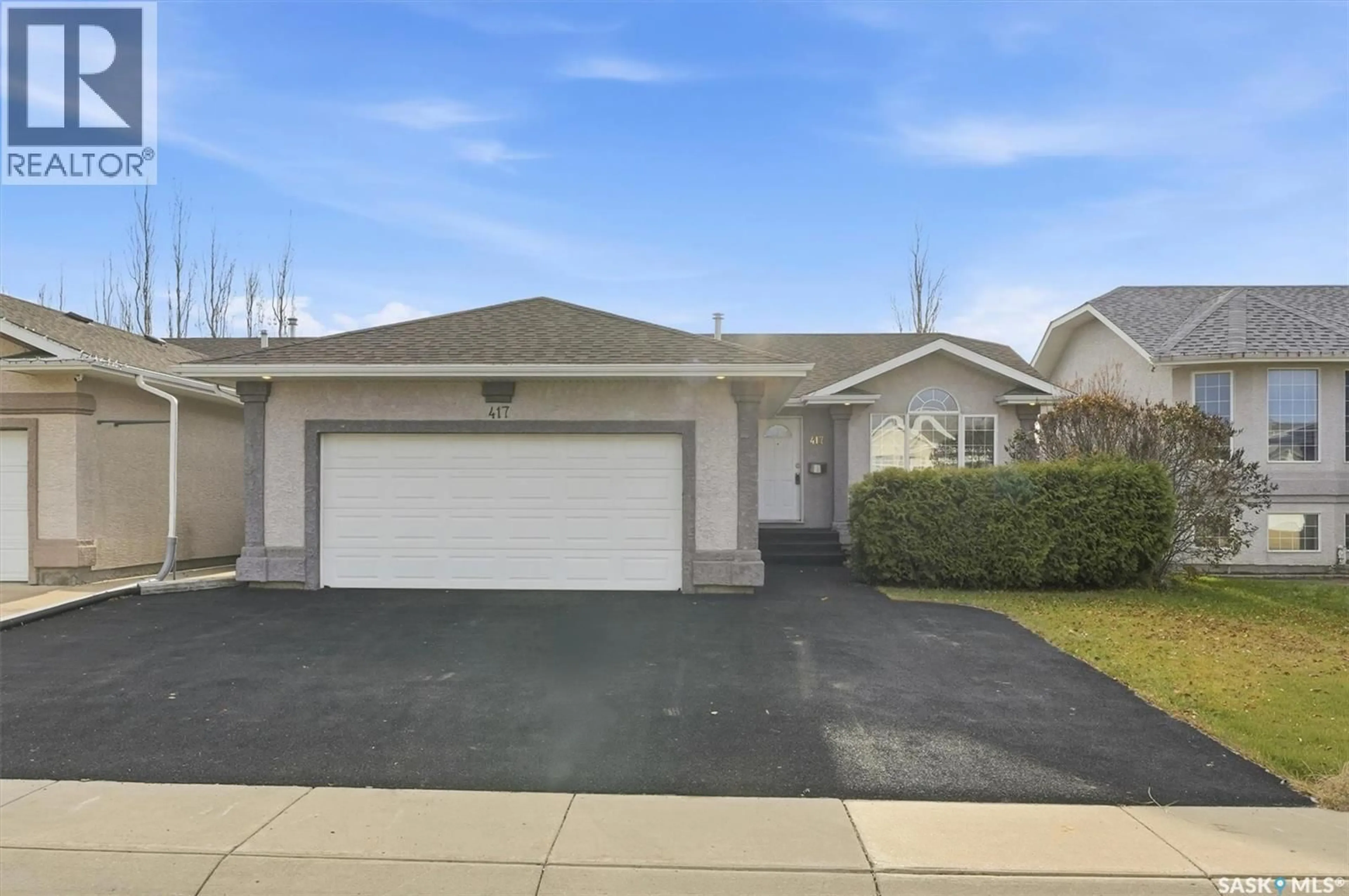 Home with vinyl exterior material, street for 417 CRYSTAL CRESCENT, Warman Saskatchewan S0K0A1