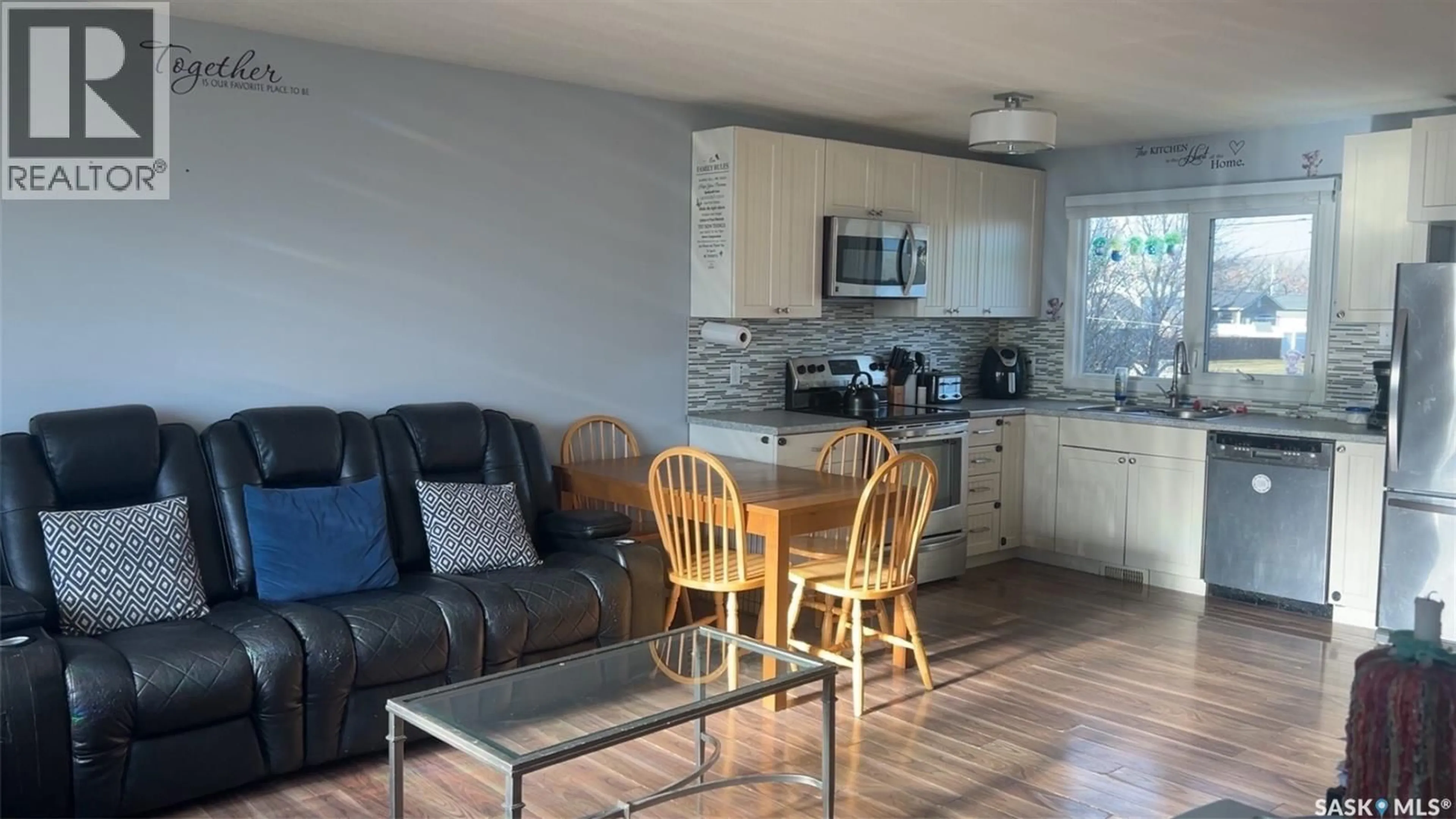 Open concept kitchen, wood/laminate floor for 109 COLLINS AVENUE, Springside Saskatchewan S0A3V0