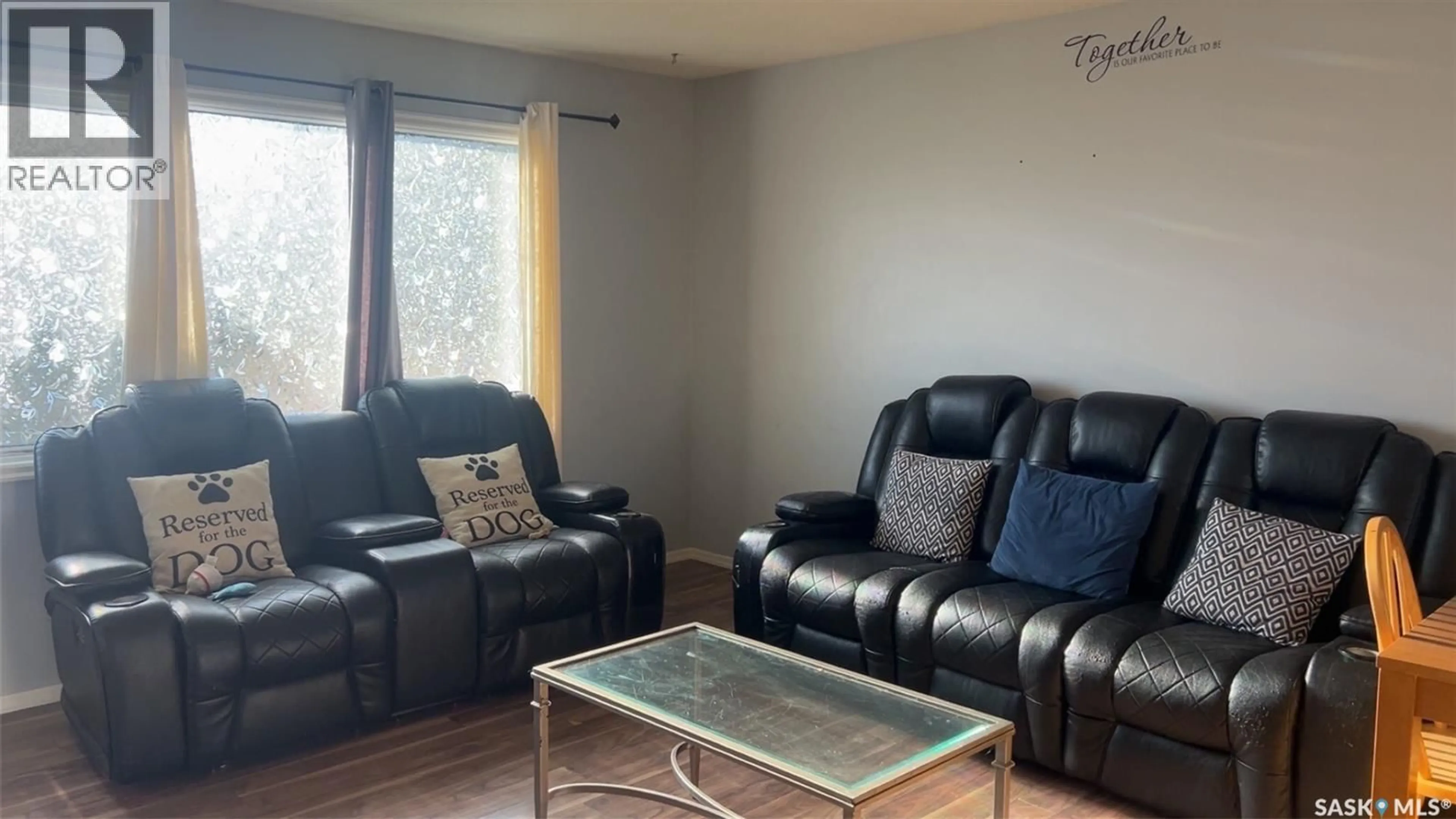 Living room with furniture, wood/laminate floor for 109 COLLINS AVENUE, Springside Saskatchewan S0A3V0