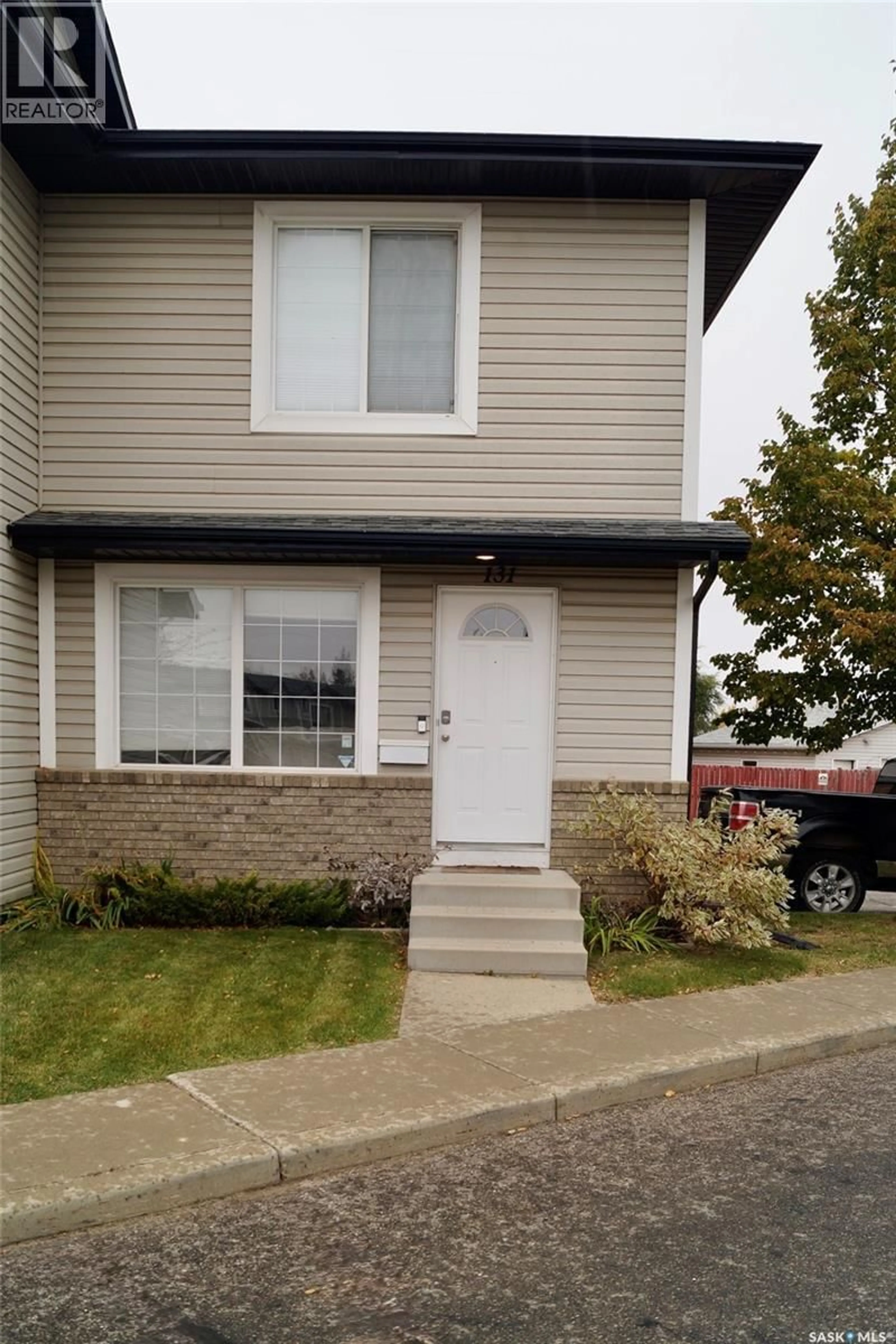 Home with vinyl exterior material, street for 103 - 131 RUTHERFORD CRESCENT, Saskatoon Saskatchewan S7N4X9