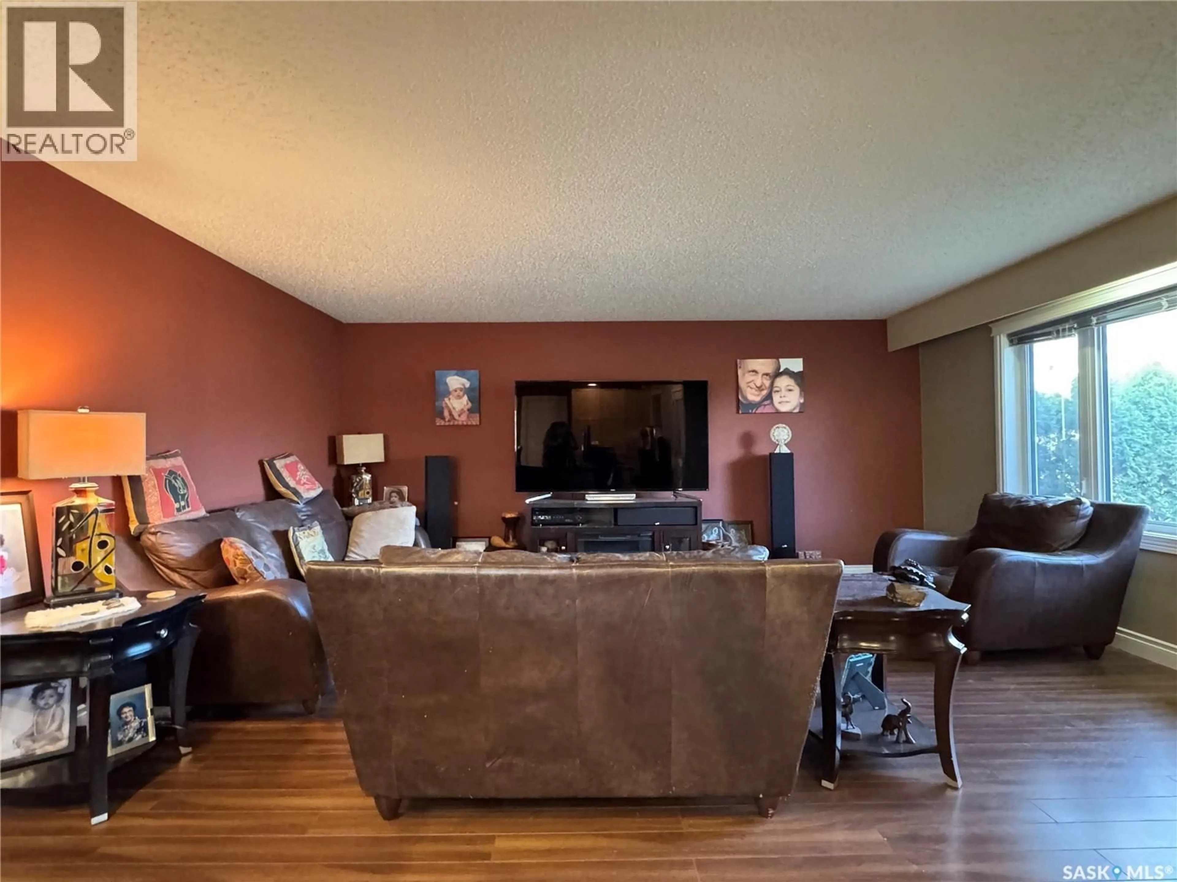 Living room with furniture, wood/laminate floor for 41 HALLERAN CRESCENT, Regina Saskatchewan S4R3Z5
