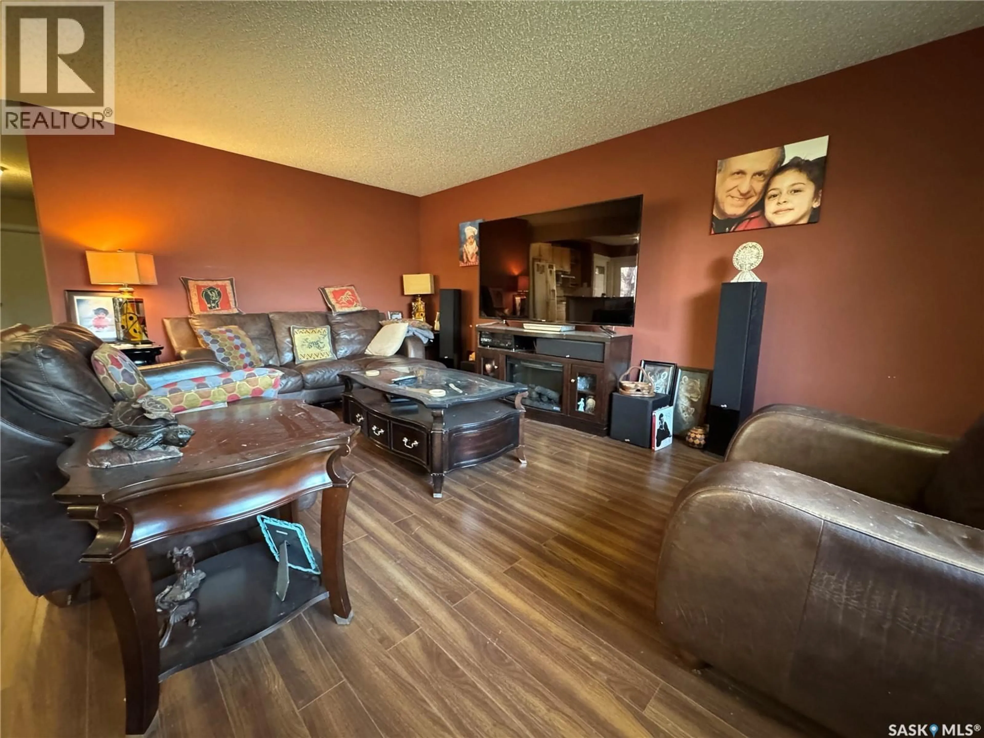 Living room with furniture, wood/laminate floor for 41 HALLERAN CRESCENT, Regina Saskatchewan S4R3Z5