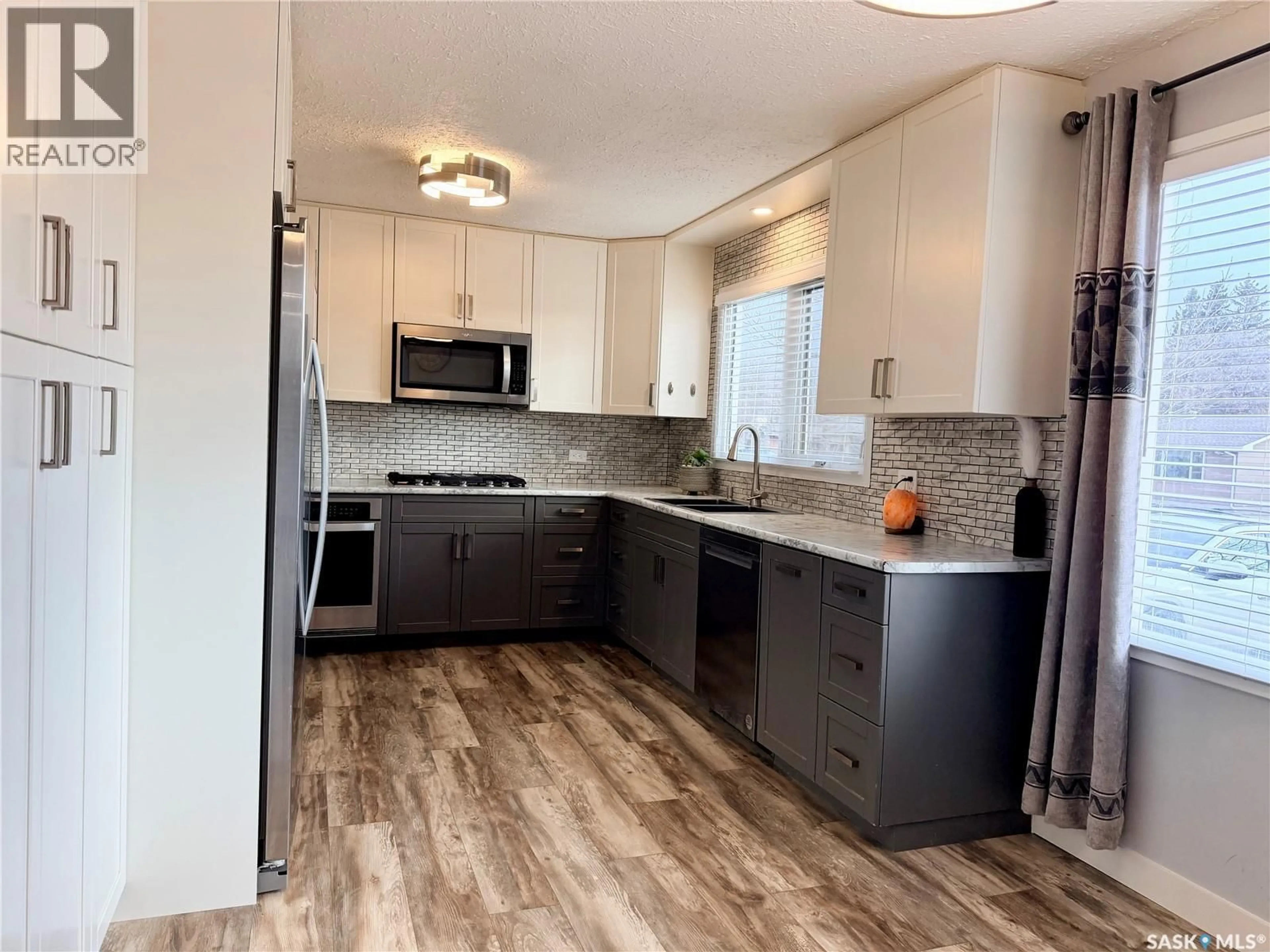 Open concept kitchen, unknown for 9019 ABBOTT AVENUE, North Battleford Saskatchewan S9A3E8