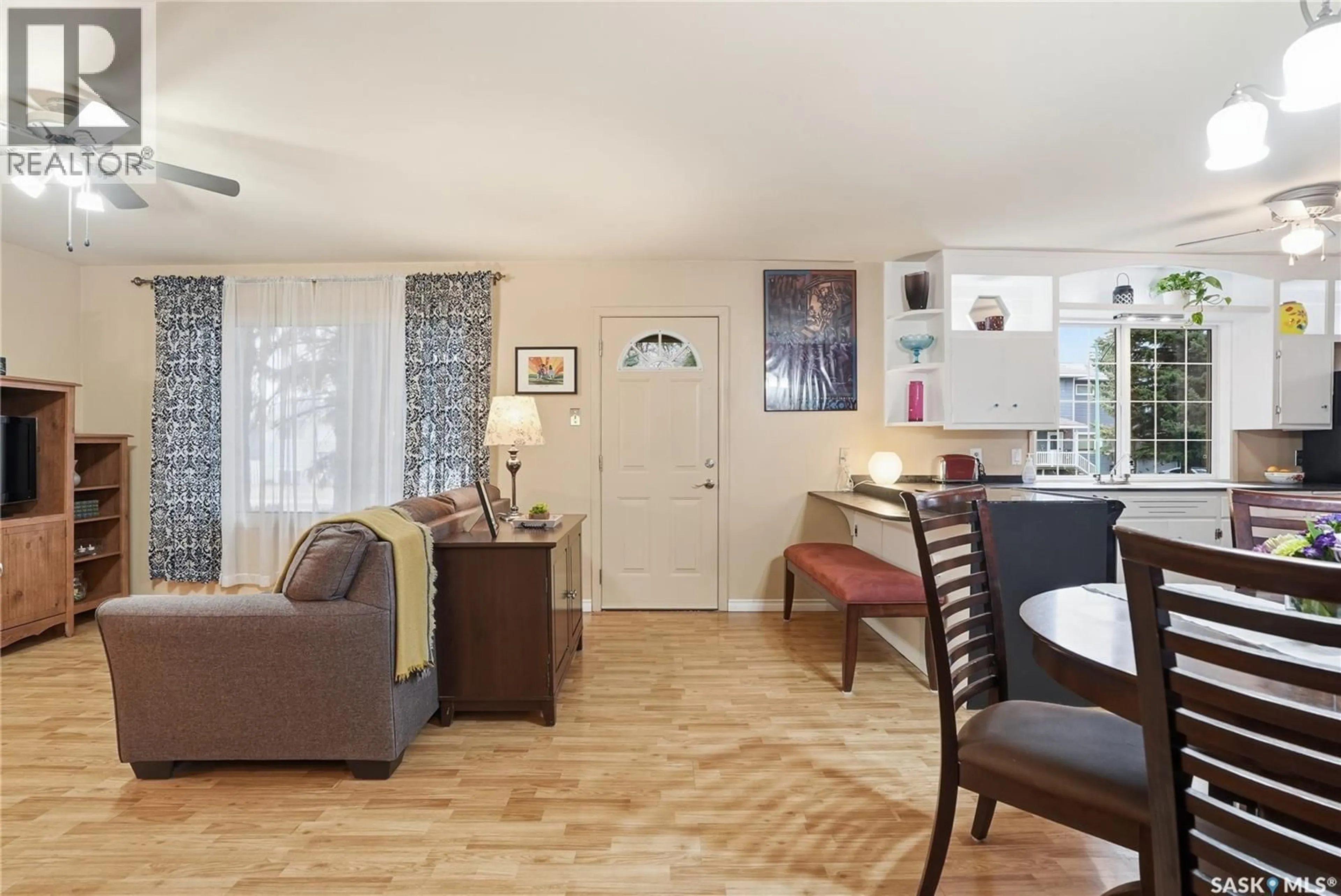 Living room with furniture, wood/laminate floor for 2120 ST ANDREWS AVENUE, Saskatoon Saskatchewan S7M0M1