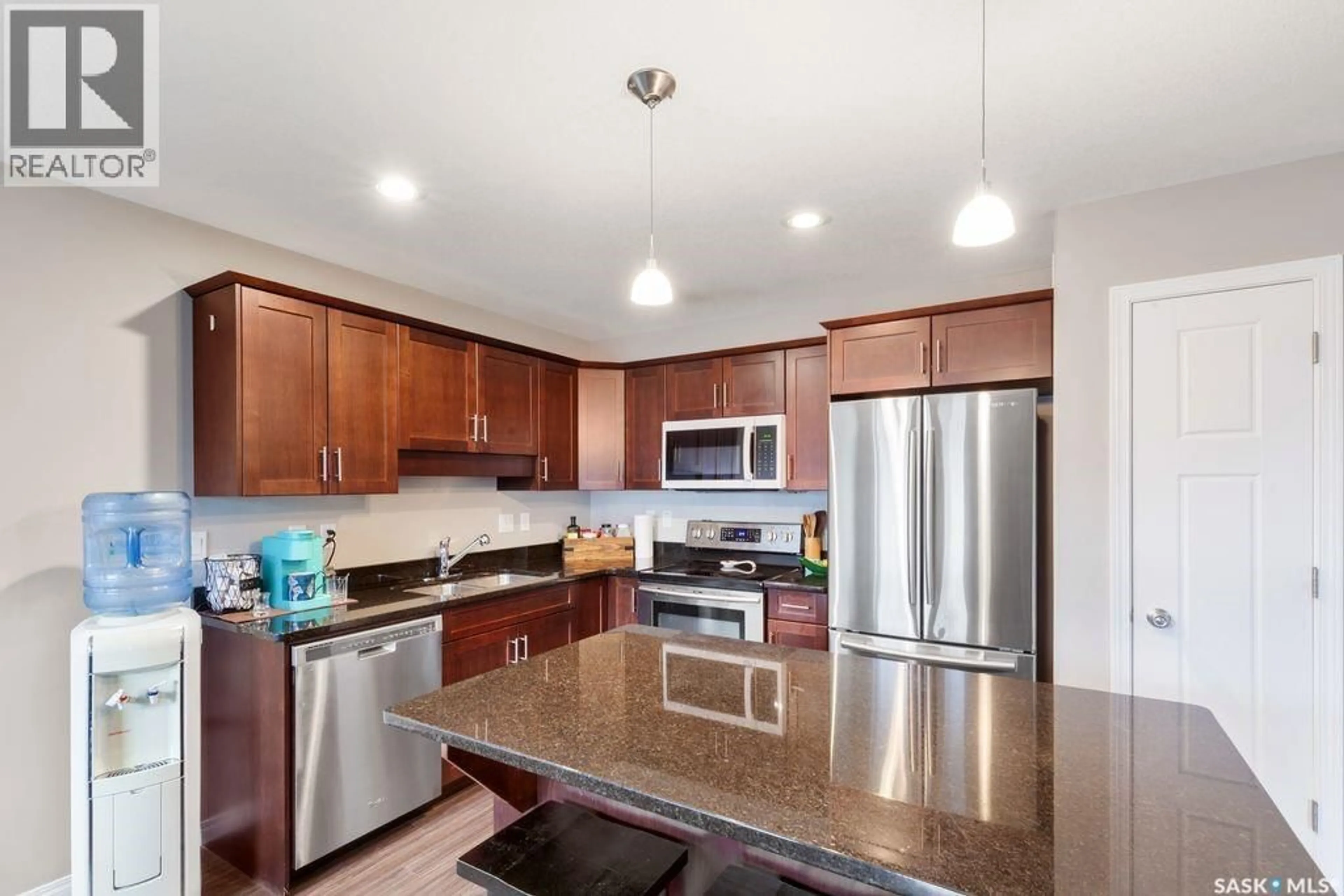 Open concept kitchen, ceramic/tile floor for 13 502 REMPEL MANOR, Saskatoon Saskatchewan S7T0L7