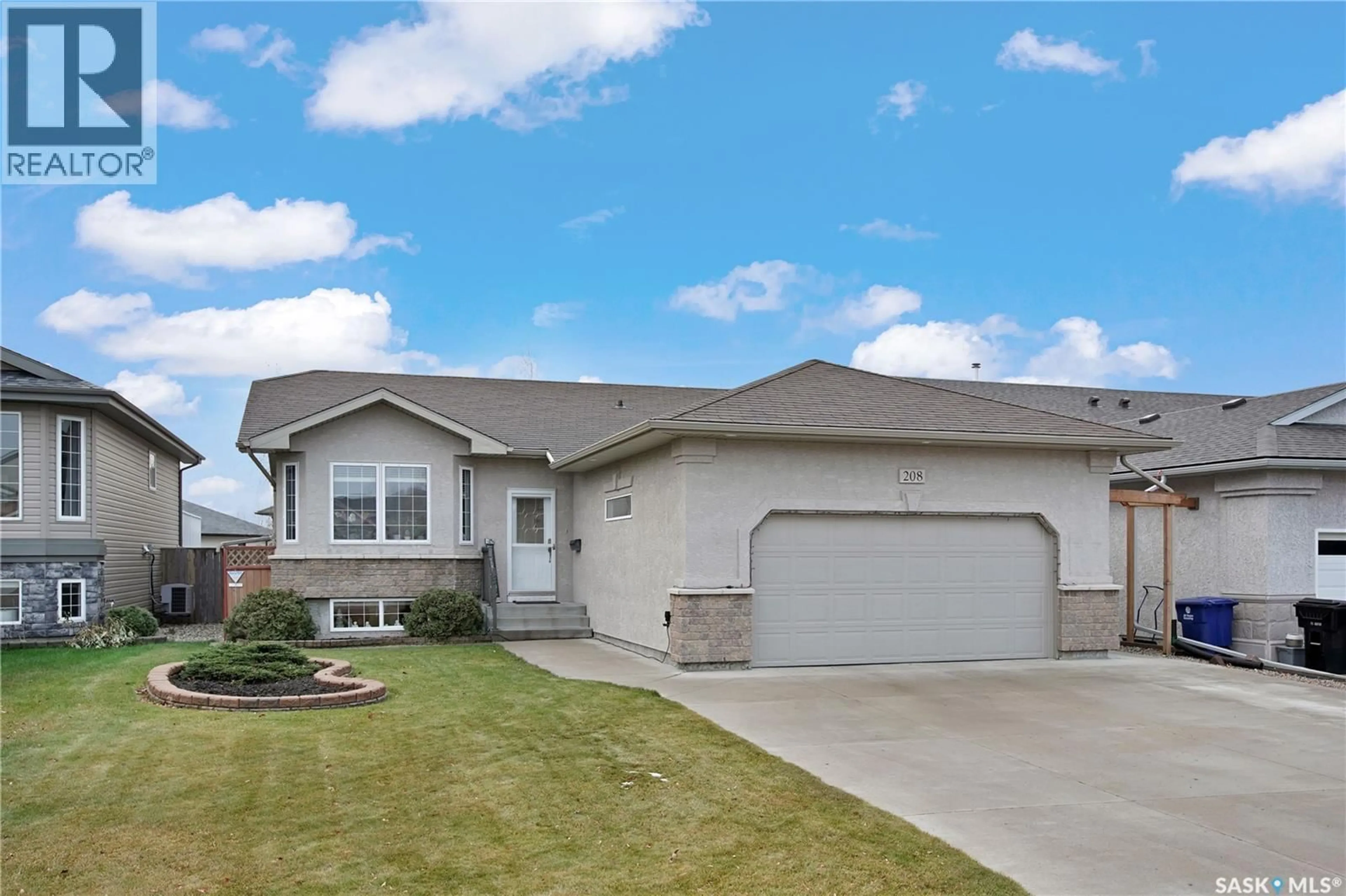Home with vinyl exterior material, street for 208 MACCORMACK ROAD, Martensville Saskatchewan S0K0A2