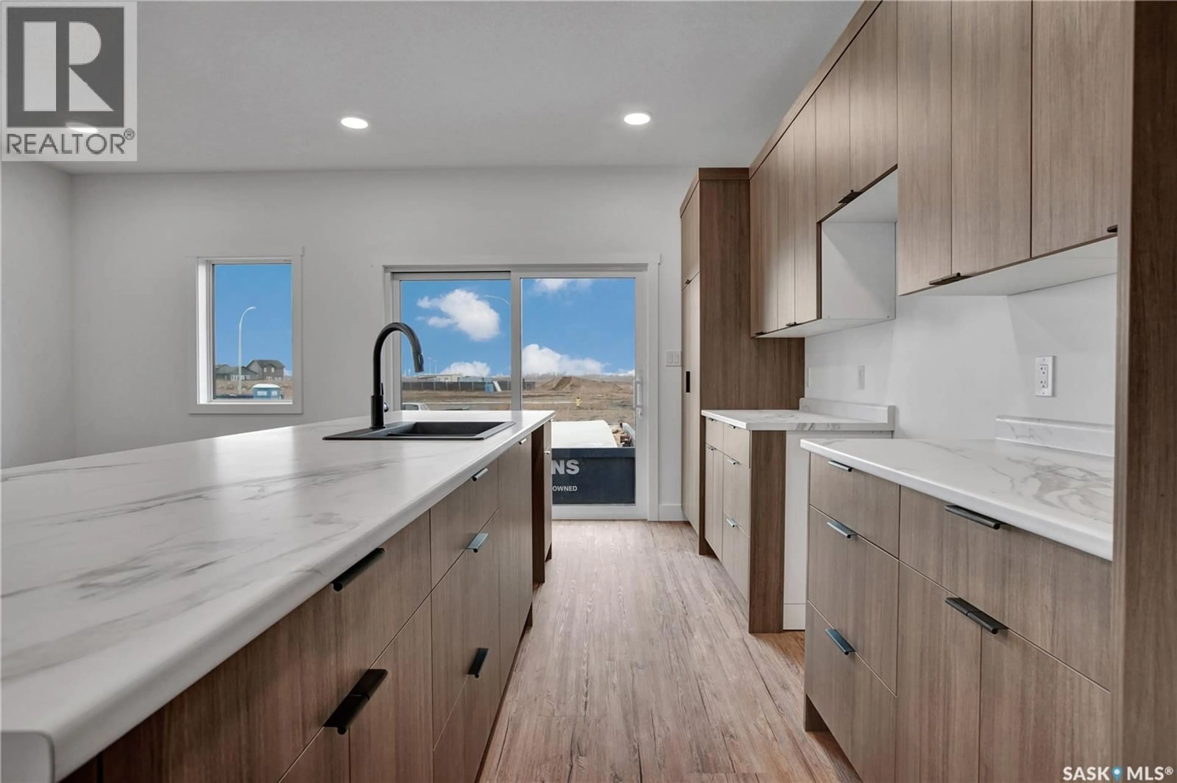 Open concept kitchen, ceramic/tile floor for 101 EMMA PLACE, Martensville Saskatchewan S0K2T1