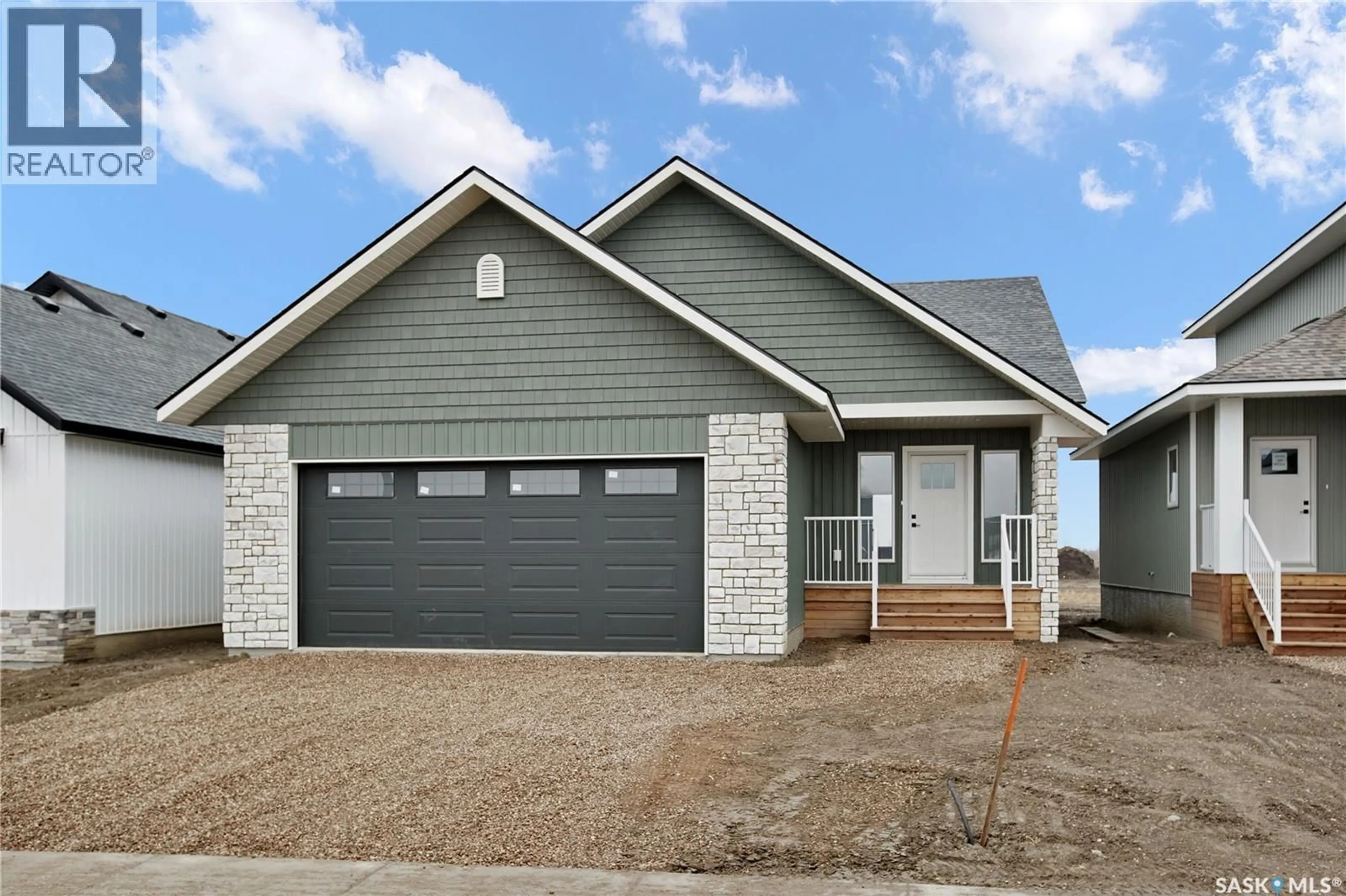 Home with vinyl exterior material, street for 105 EMMA PLACE, Martensville Saskatchewan S0K2T1