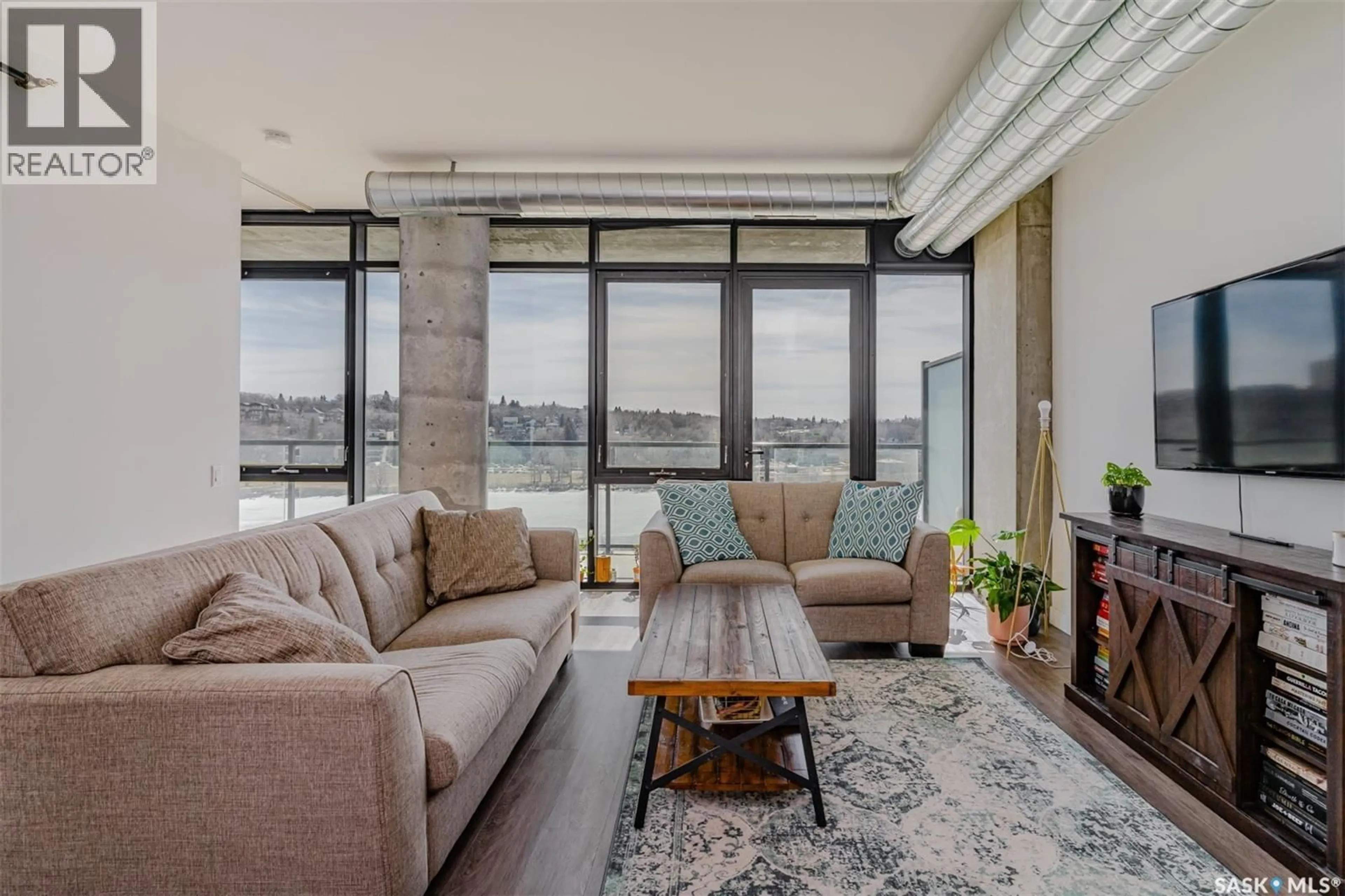 Living room with furniture, cement floor for 490 - 508 2ND AVENUE, Saskatoon Saskatchewan S7K4H5