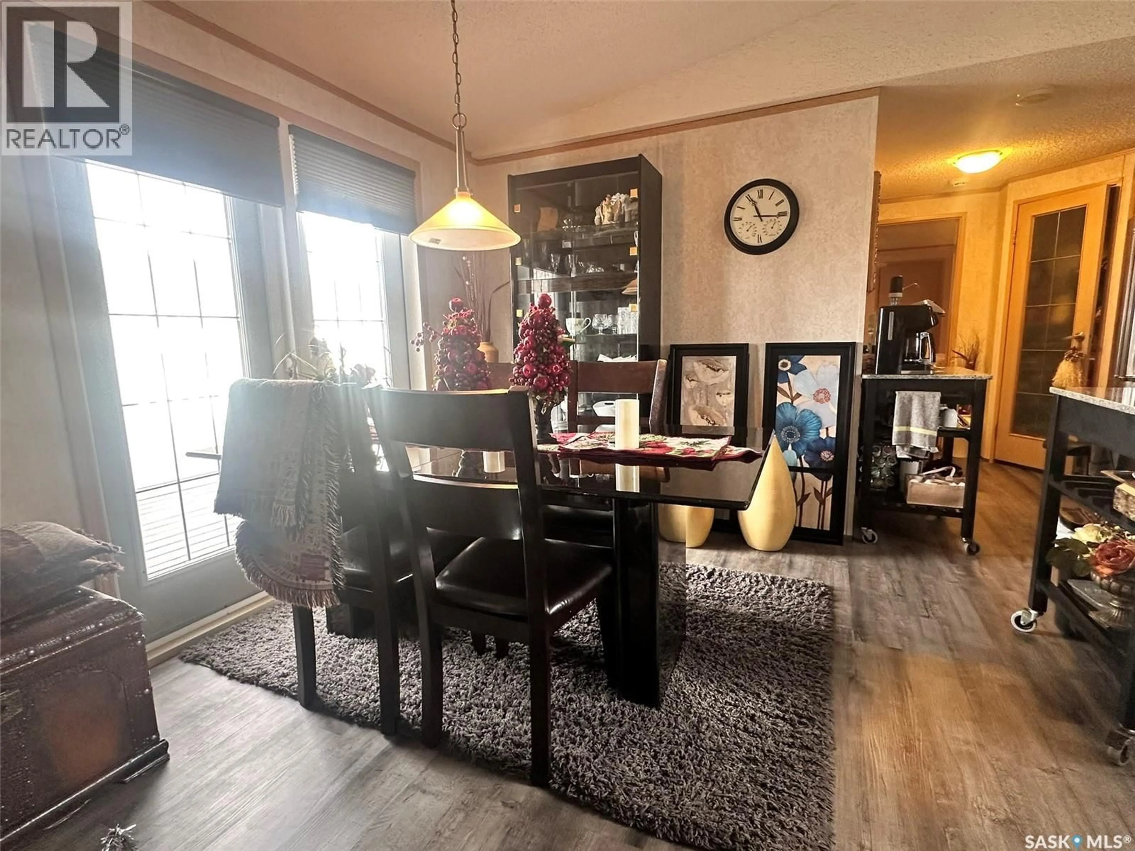 Dining room, wood/laminate floor for 65 SUNRISE ESTATES, Assiniboia Saskatchewan S0H0B0