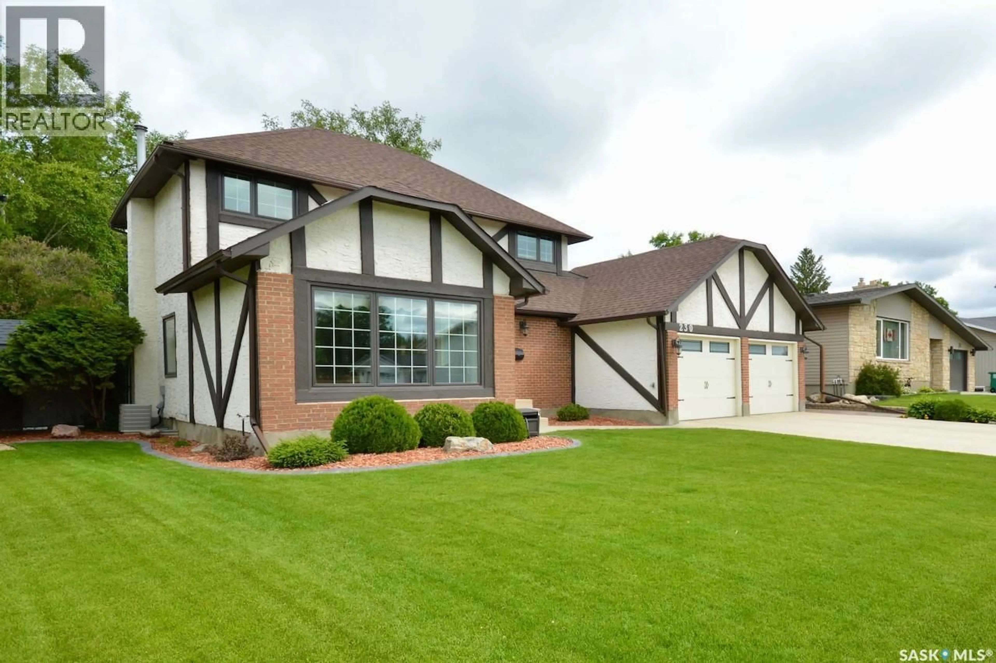 Home with brick exterior material, street for 230 DORE CRESCENT, Saskatoon Saskatchewan S7K4X9