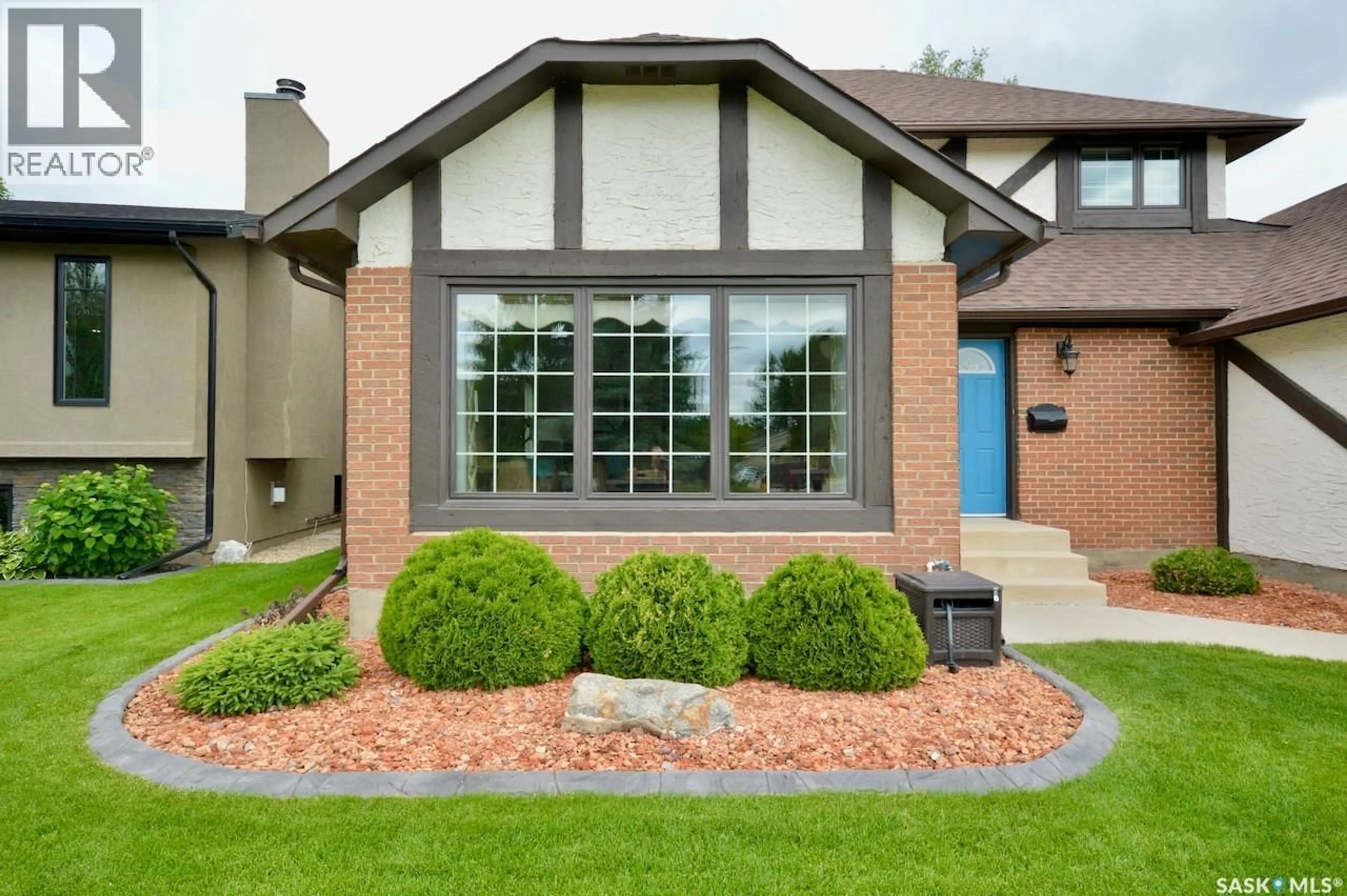 Home with brick exterior material, street for 230 DORE CRESCENT, Saskatoon Saskatchewan S7K4X9