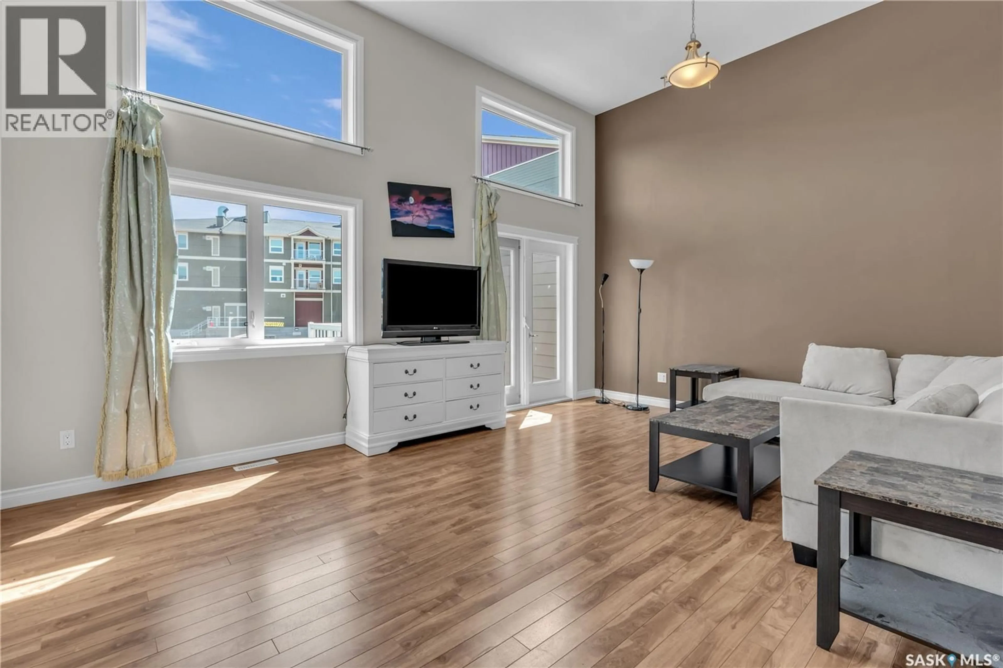 Living room with furniture, unknown for 103 212 WILLIS CRESCENT, Saskatoon Saskatchewan S7T0R6