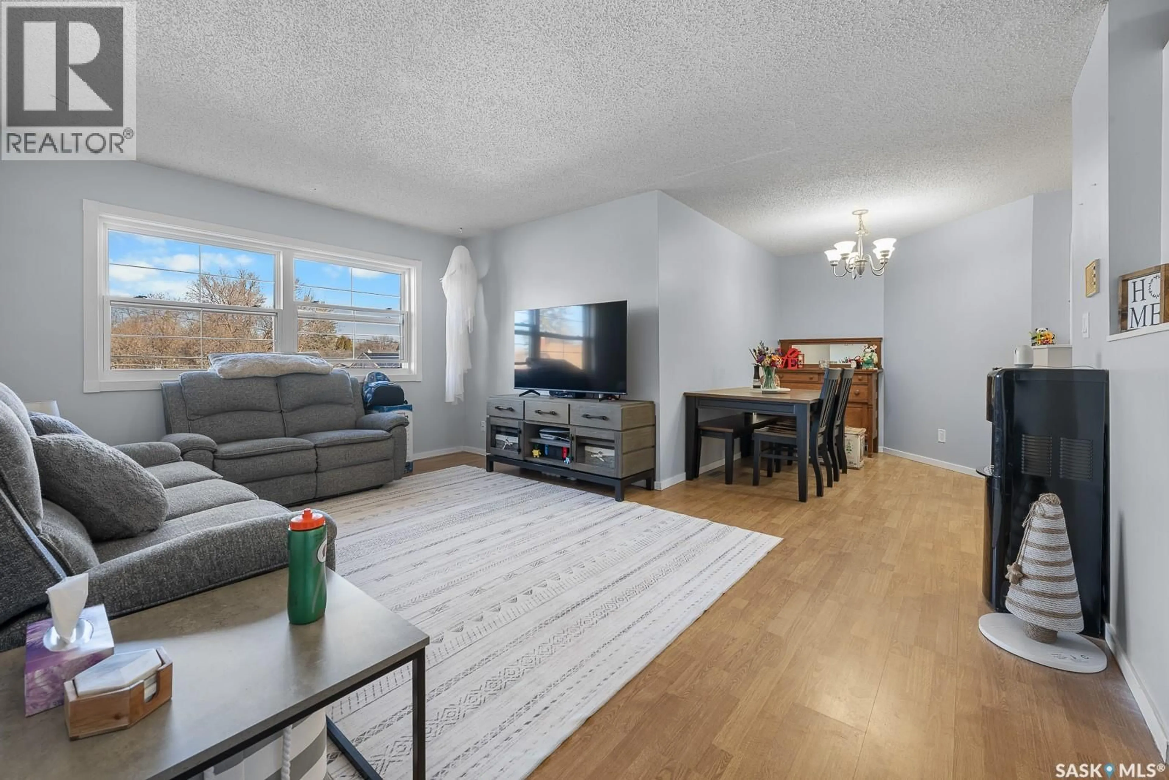 Living room with furniture, wood/laminate floor for 4008 DEWDNEY STREET, Regina Saskatchewan S4T1A2