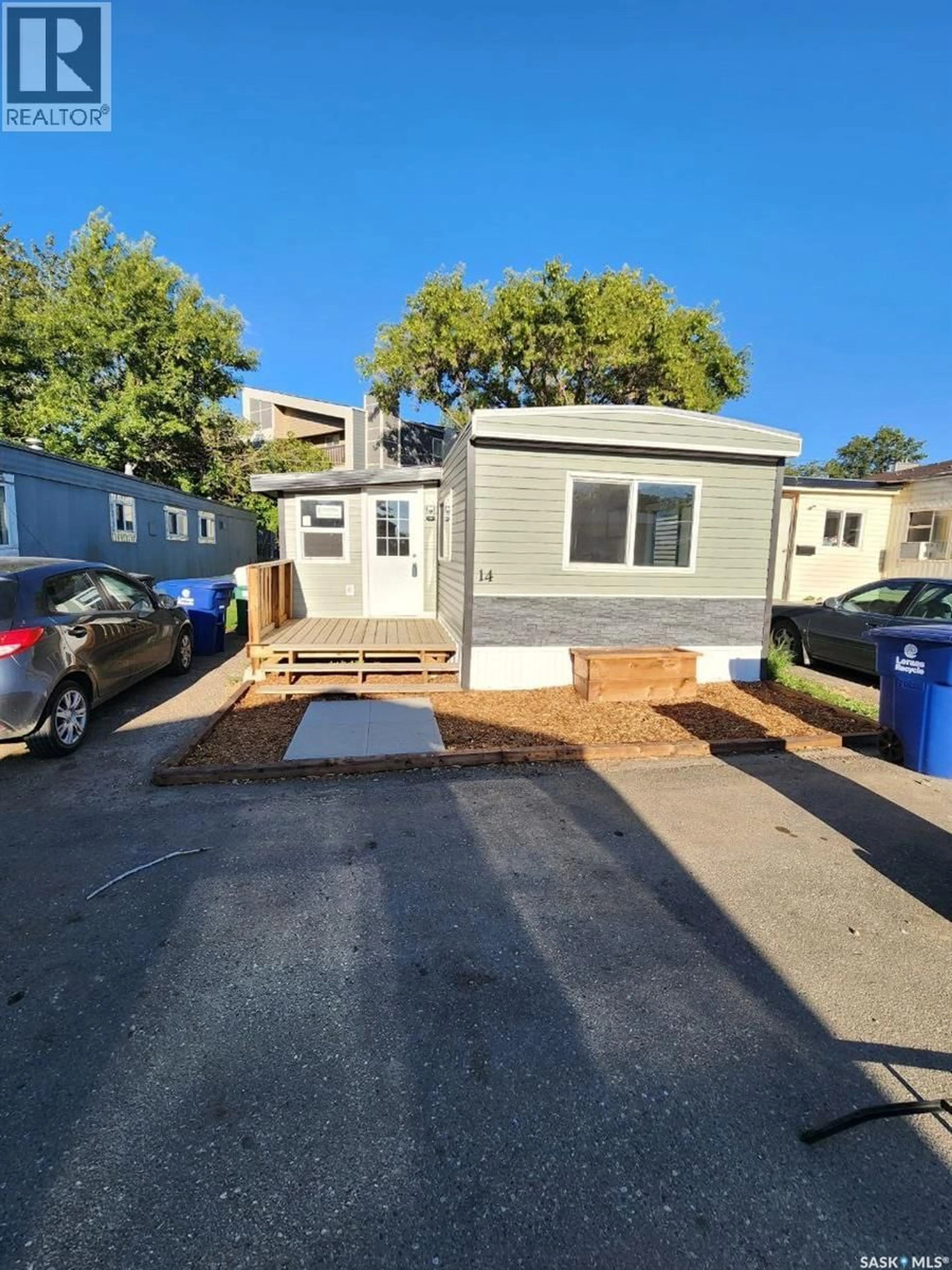 Home with vinyl exterior material, street for 14 321 DUNLOP STREET, Saskatoon Saskatchewan S7N2P7