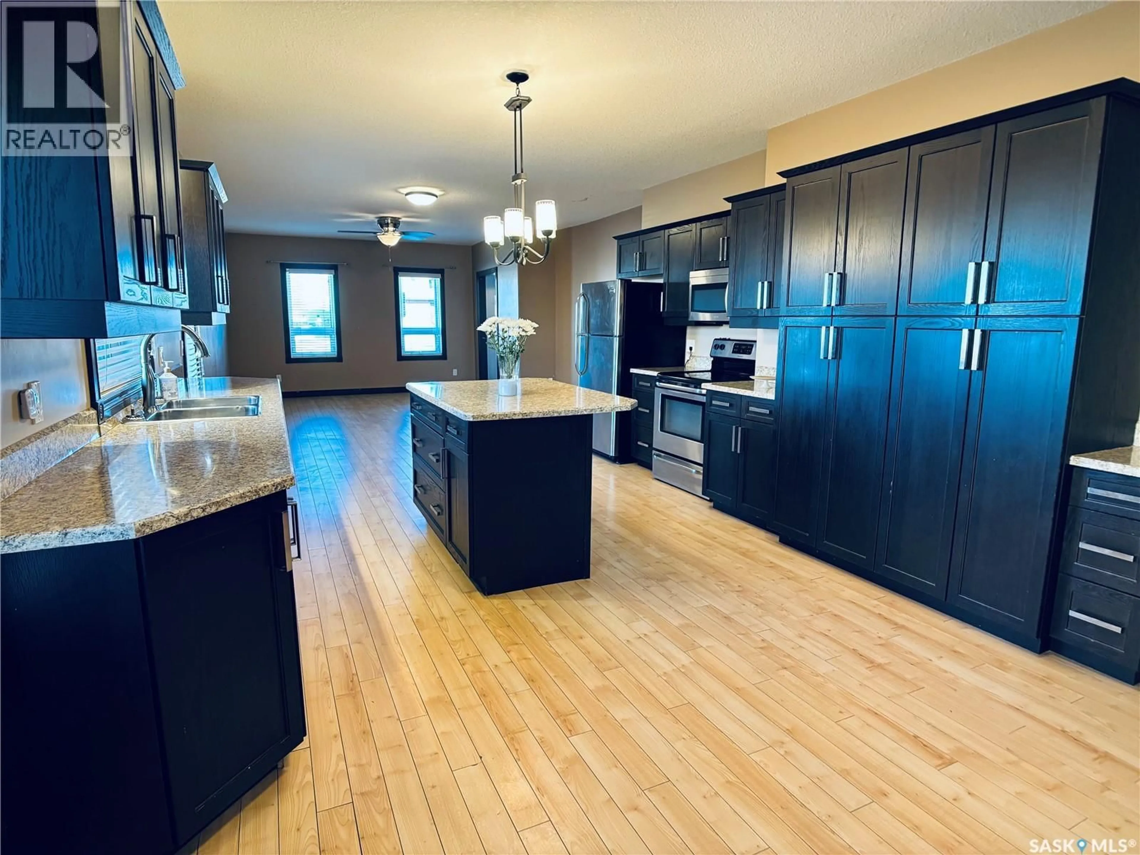 Open concept kitchen, wood/laminate floor for 1208 SIXTH STREET, Estevan Saskatchewan S4A1B1
