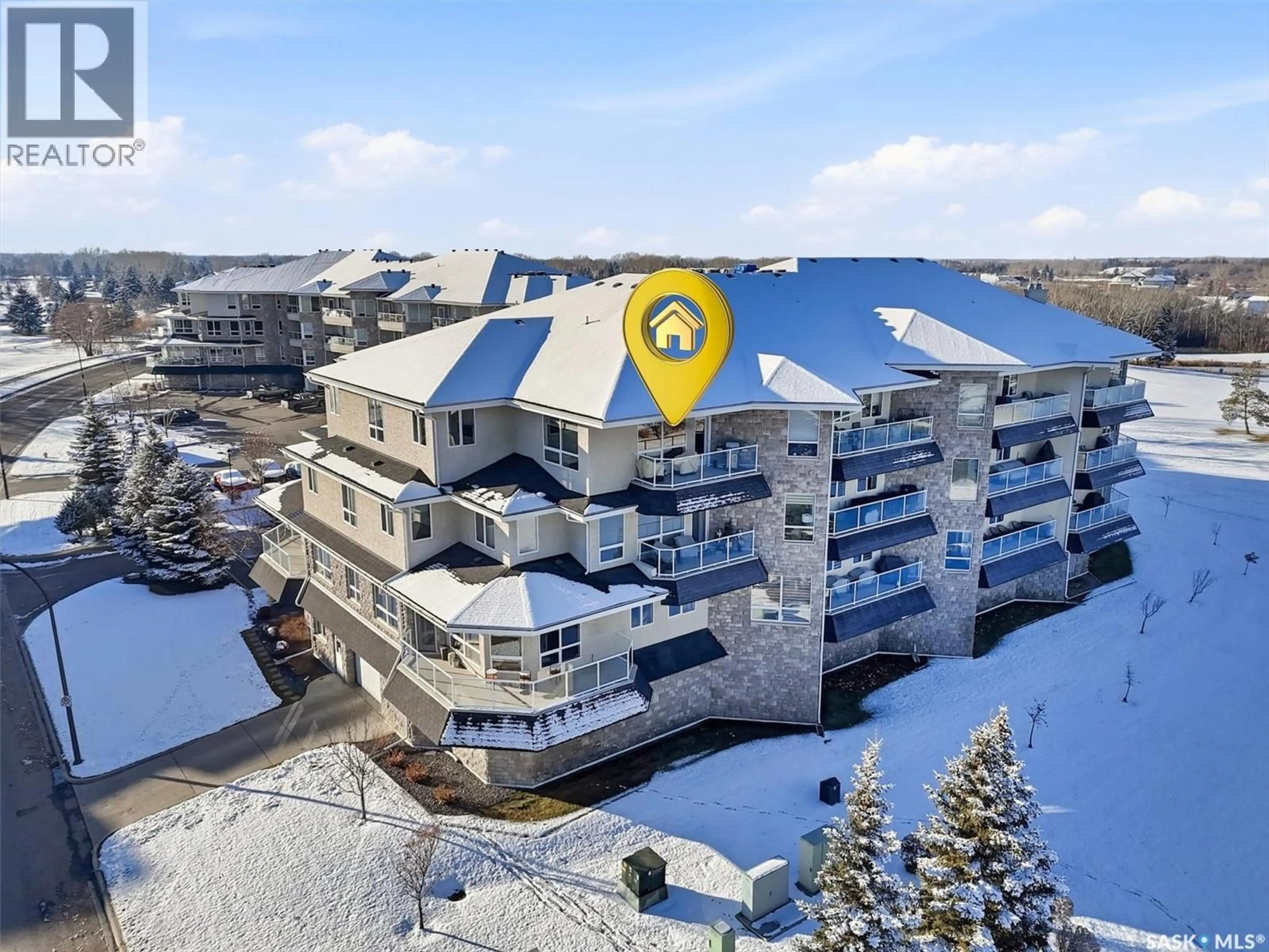 A pic from outside/outdoor area/front of a property/back of a property/a pic from drone, water/lake/river/ocean view for 407 405 CARTWRIGHT STREET, Saskatoon Saskatchewan S7T0C8