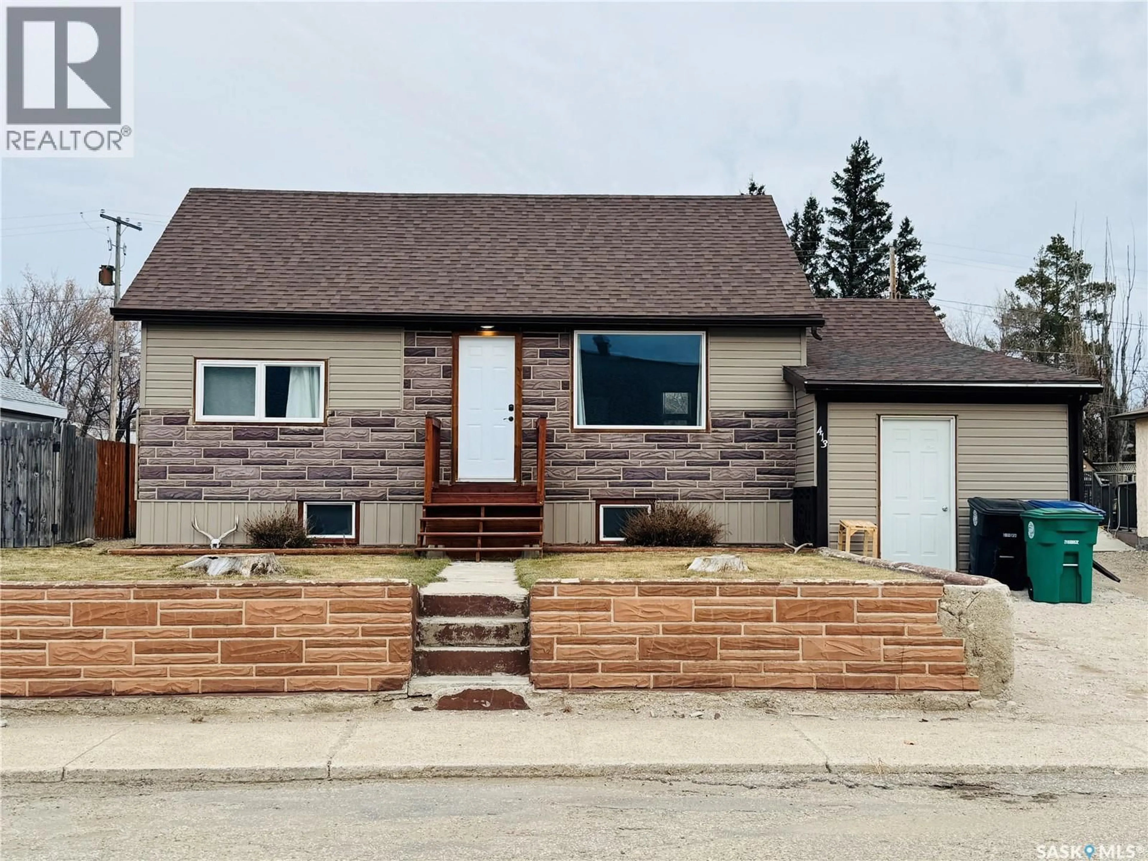 Home with brick exterior material, street for 413 2ND AVENUE, Biggar Saskatchewan S0K0M0