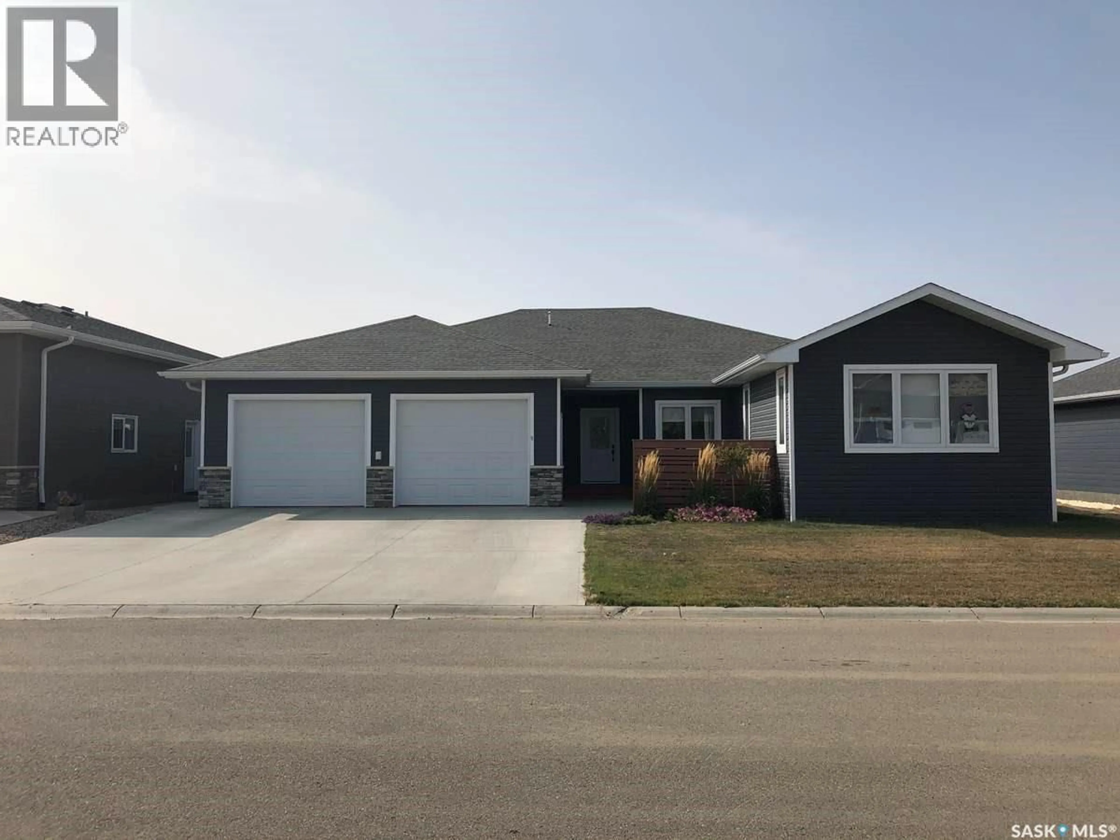 Home with vinyl exterior material, street for 9 WARREN STREET, Redvers Saskatchewan S0C2H0