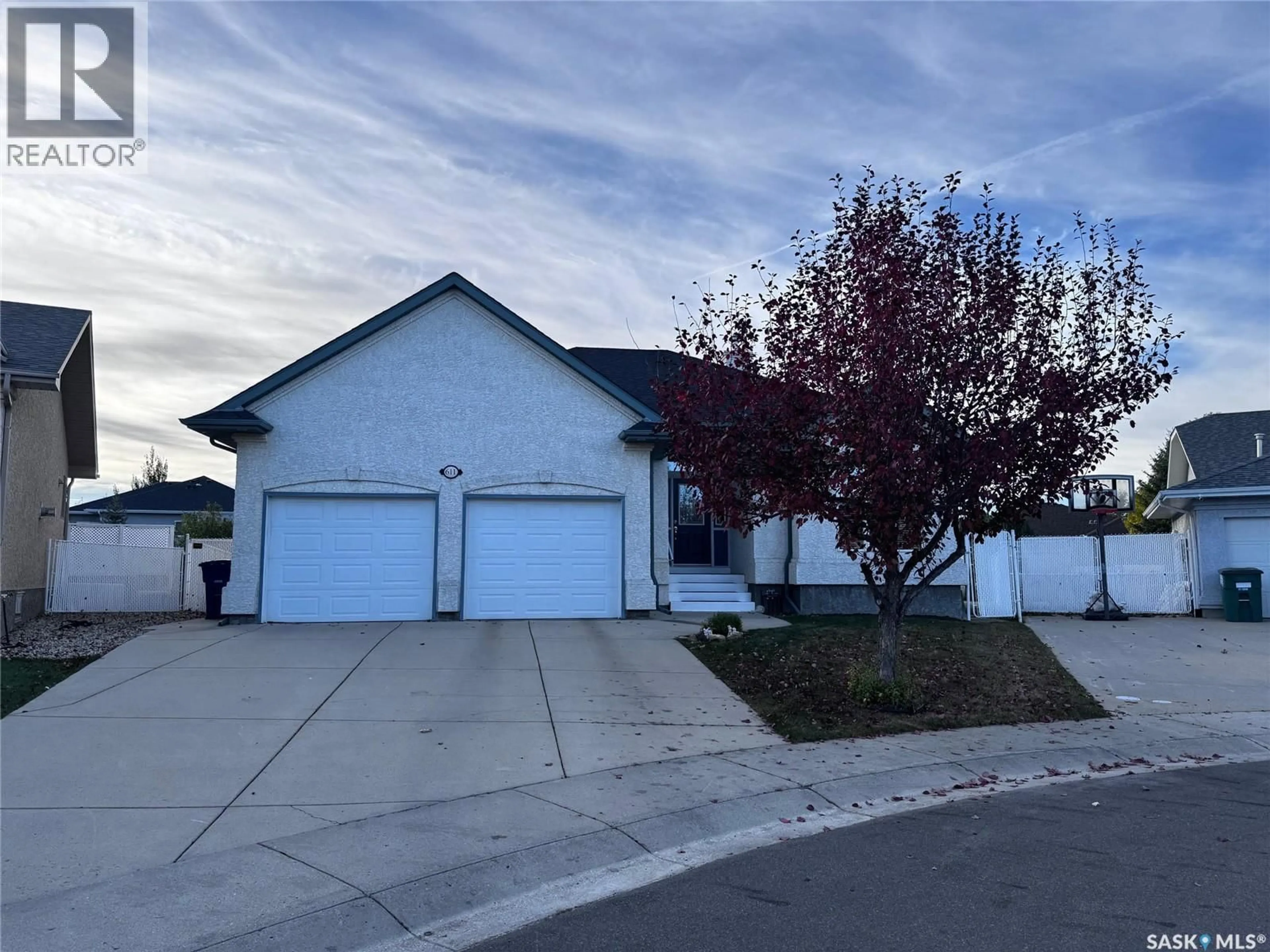 Home with vinyl exterior material, street for 611 LE MAY COURT, Saskatoon Saskatchewan S7S1L2