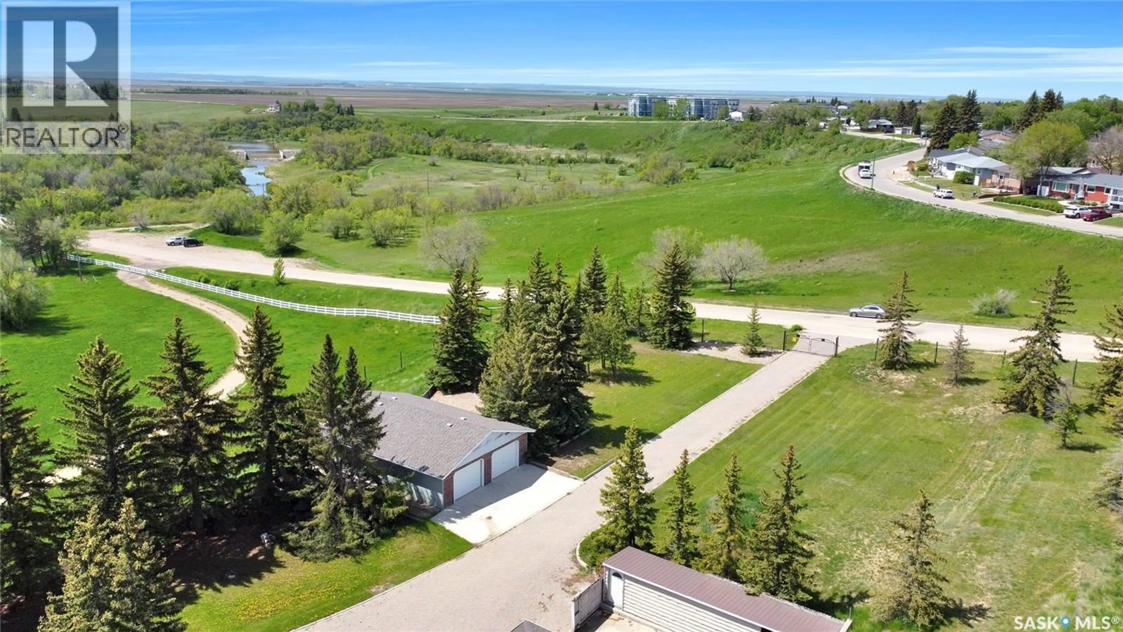 A pic from outside/outdoor area/front of a property/back of a property/a pic from drone, water/lake/river/ocean view for 1055 7TH AVENUE, Moose Jaw Saskatchewan S6H5R2