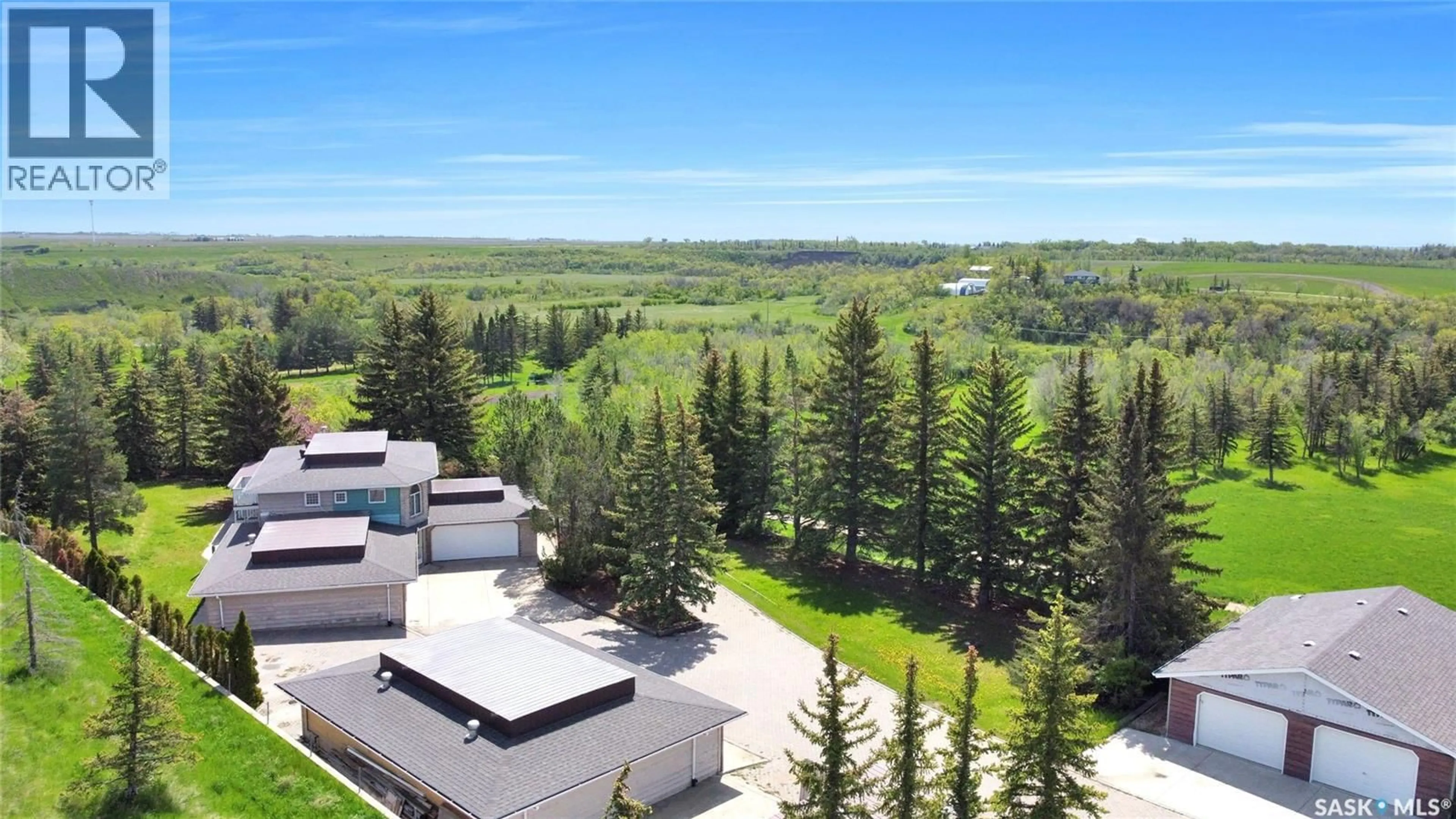 A pic from outside/outdoor area/front of a property/back of a property/a pic from drone, mountain view for 1055 7TH AVENUE, Moose Jaw Saskatchewan S6H5R2