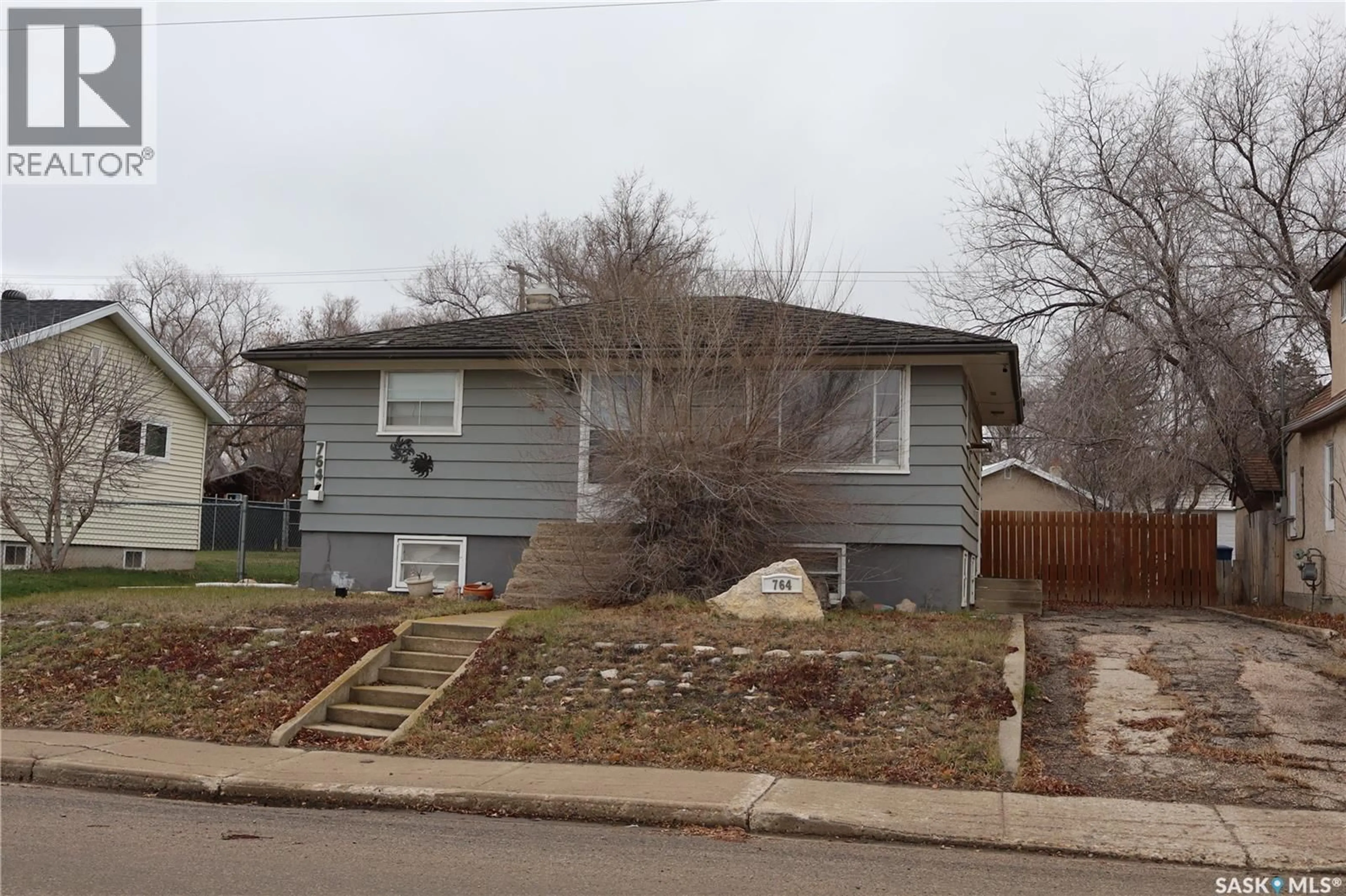 Home with vinyl exterior material, street for 764 FAIRFORD STREET, Moose Jaw Saskatchewan S6H0G2