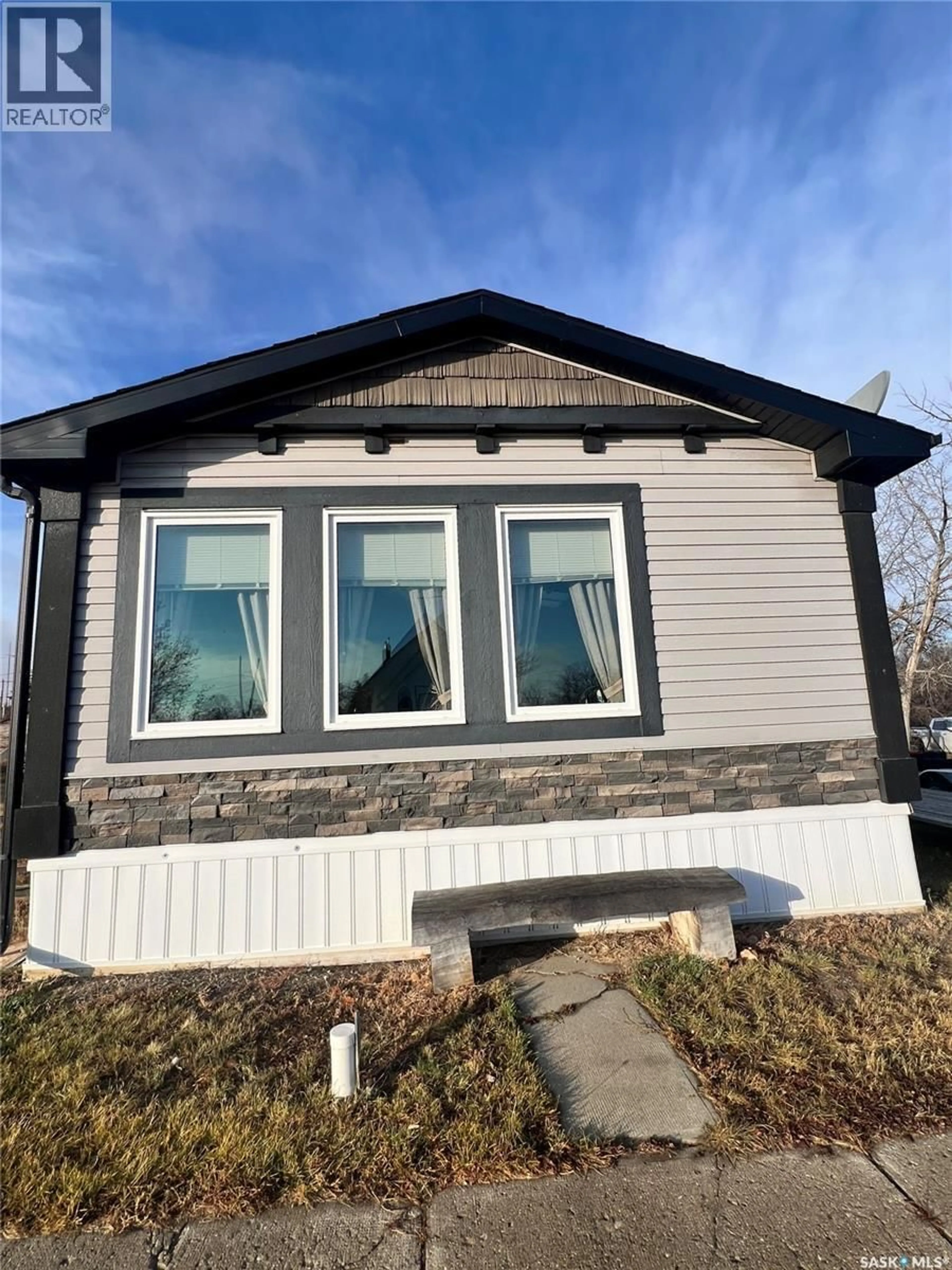 Home with vinyl exterior material, building for 42 2ND STREET, Tompkins Saskatchewan S0N2S0