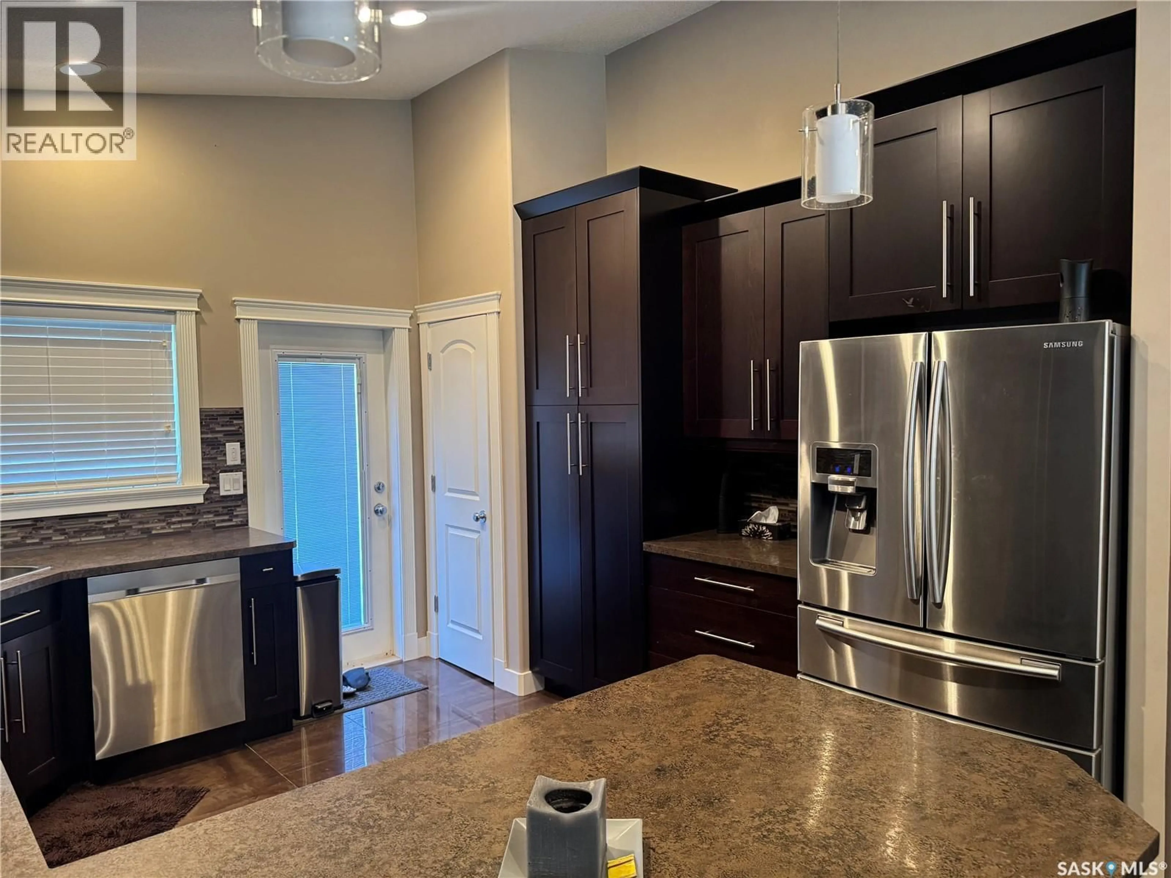 Open concept kitchen, unknown for 916 3RD STREET, Weyburn Saskatchewan S4H3J8