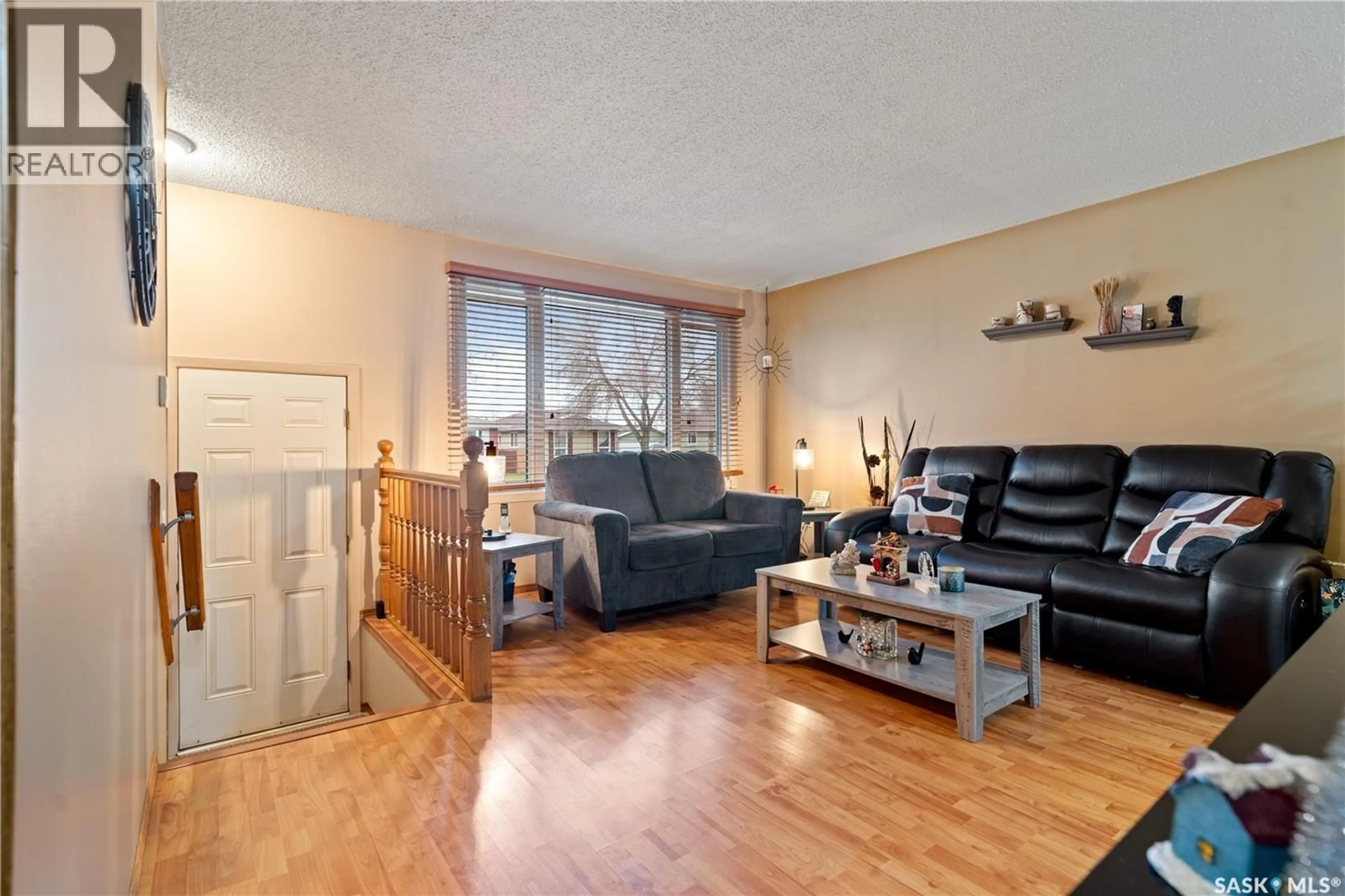Living room with furniture, wood/laminate floor for 126 CHURCH DRIVE, Regina Saskatchewan S4X1P8
