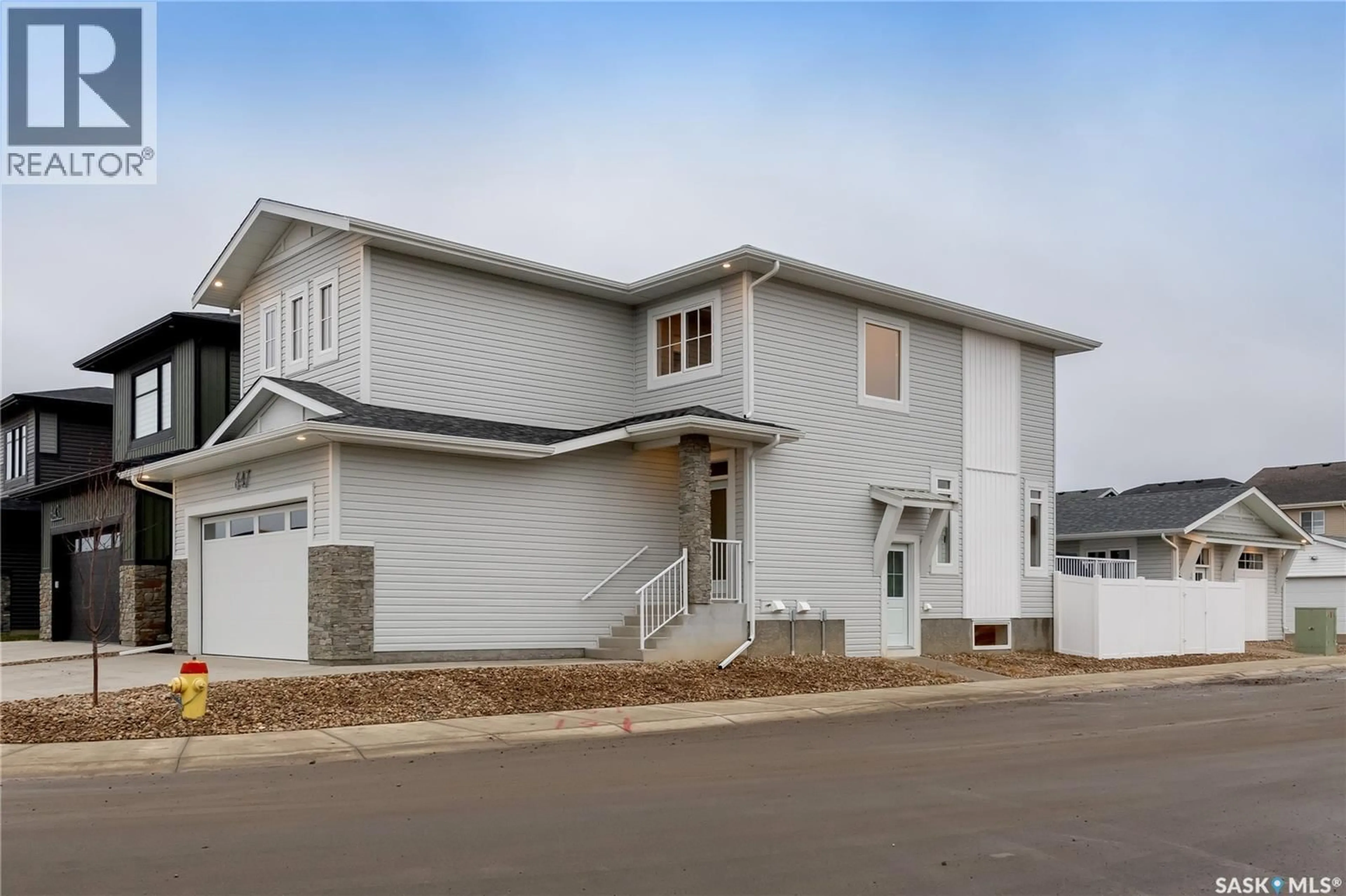 Home with vinyl exterior material, street for 647 PEPPER BEND, Saskatoon Saskatchewan S7V1T1