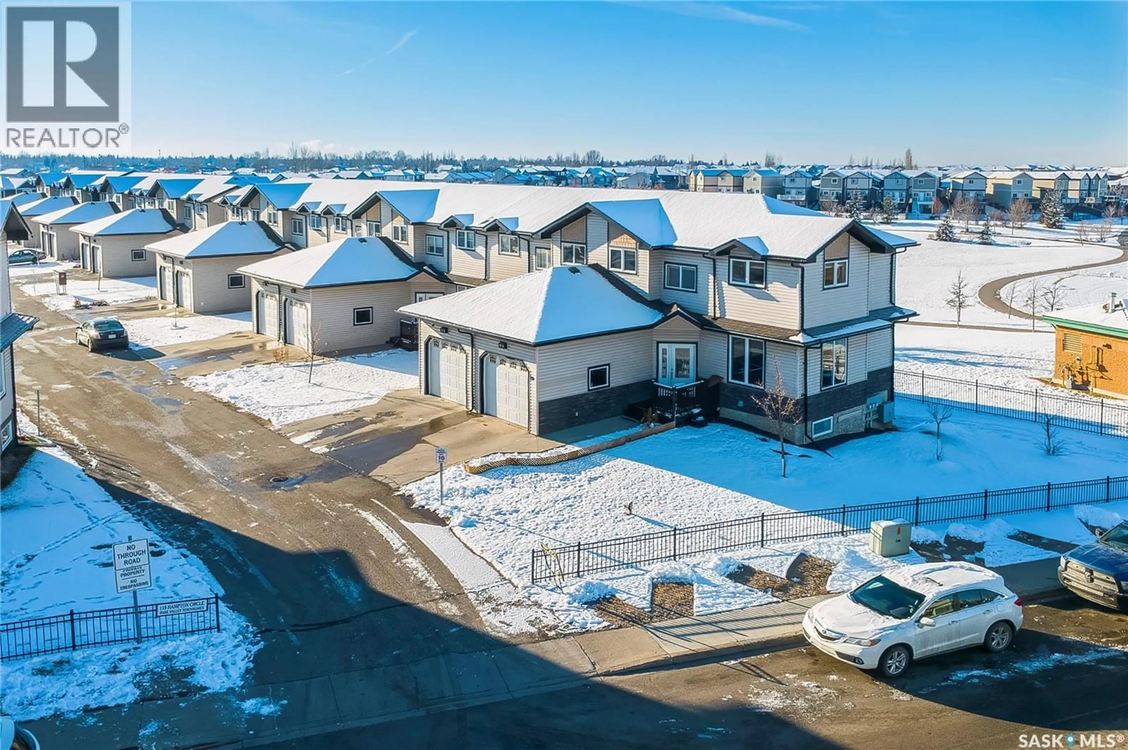 A pic from outside/outdoor area/front of a property/back of a property/a pic from drone, unknown for 28 118 HAMPTON CIRCLE, Saskatoon Saskatchewan S7R0C9